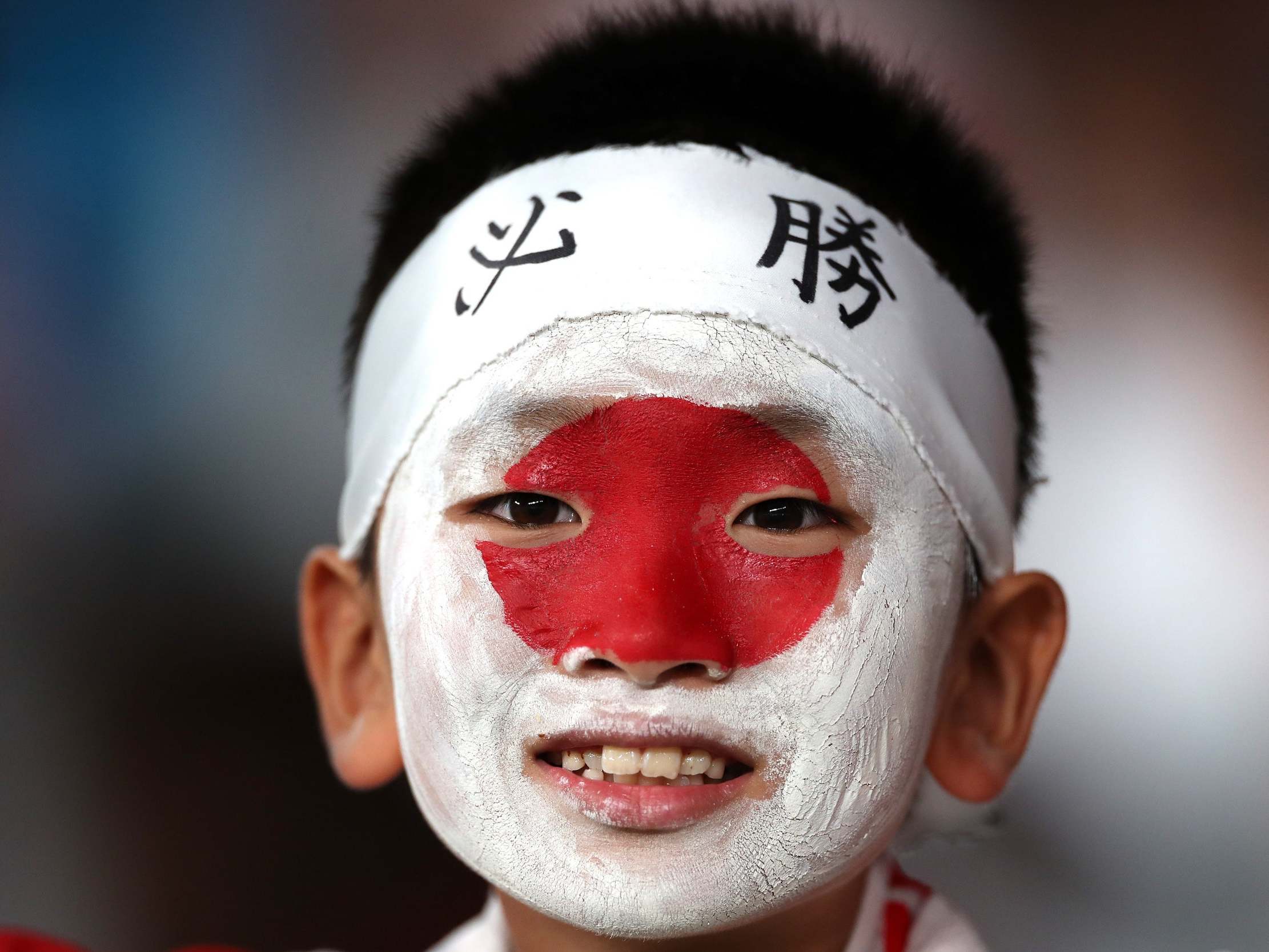 A young Japanese fan ahead of the quarter-final