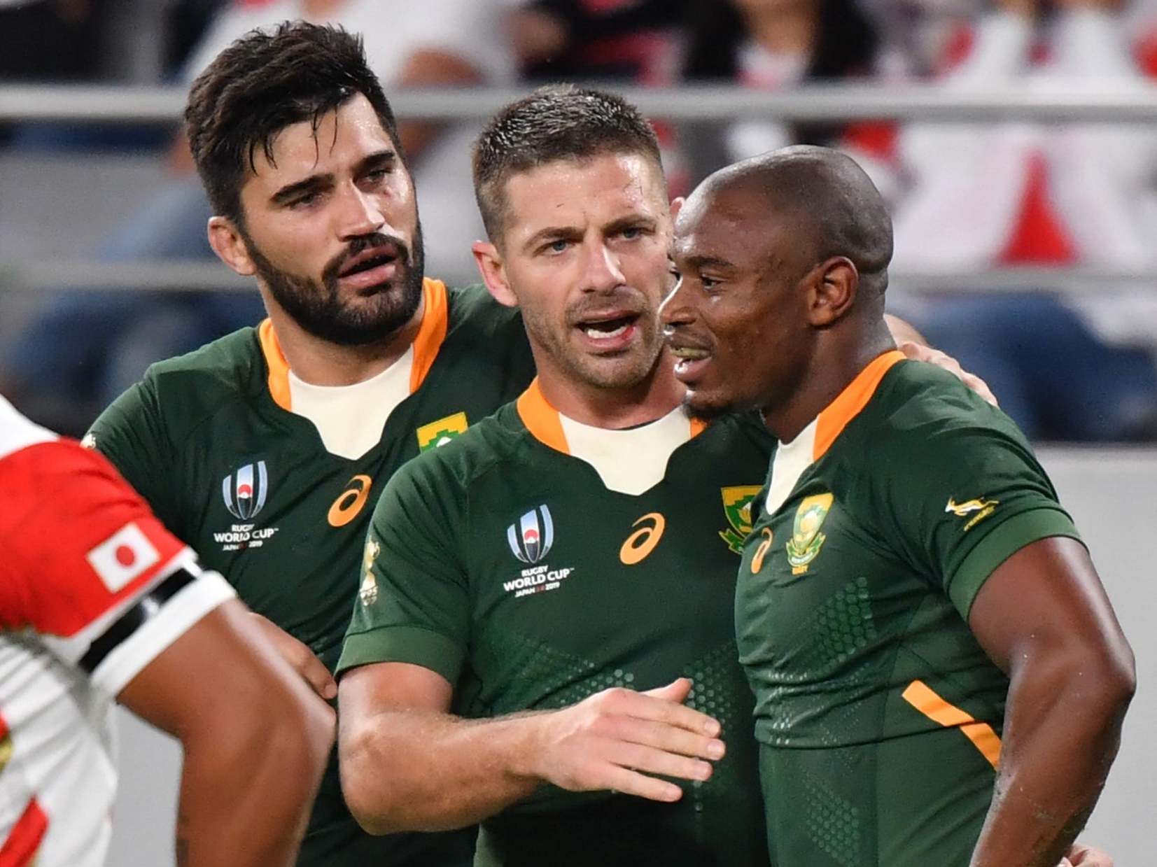 South Africa celebrate after securing victory over Japan