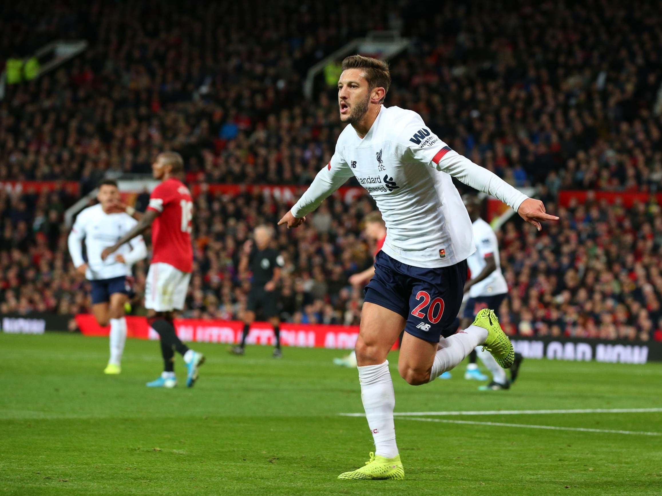 Adam Lallana celebrates after scoring Liverpool's late equaliser