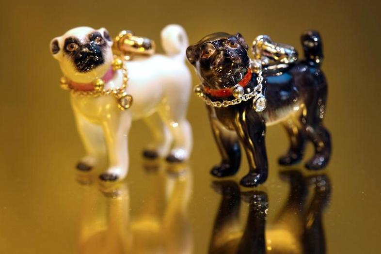 Porcelain pendants in the form of miniature pugs made in Meissen