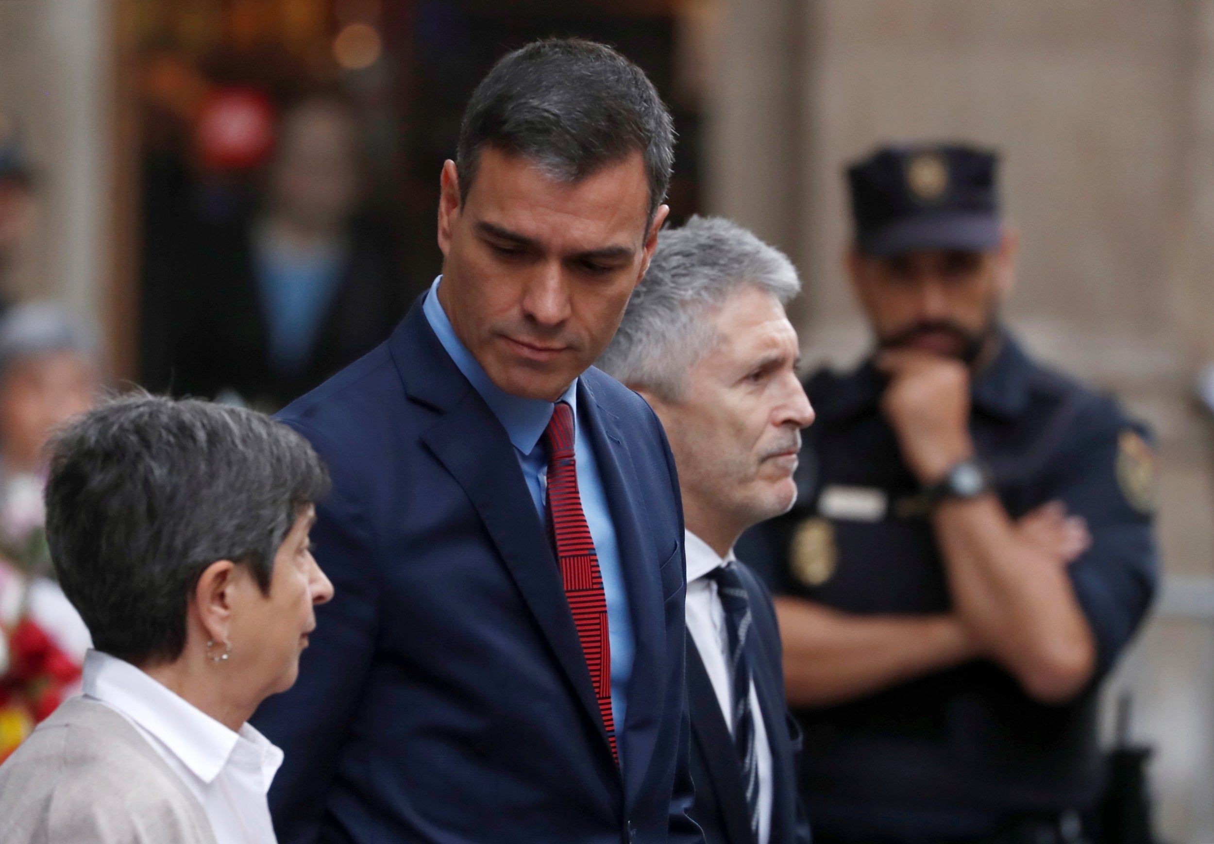 Spain's acting Prime Minister Pedro Sanchez and Spain's acting Interior Minister Fernando Grande-Marlaska leave the National Police headquarters after a visit, in Barcelona, Spain, October 21, 2019.