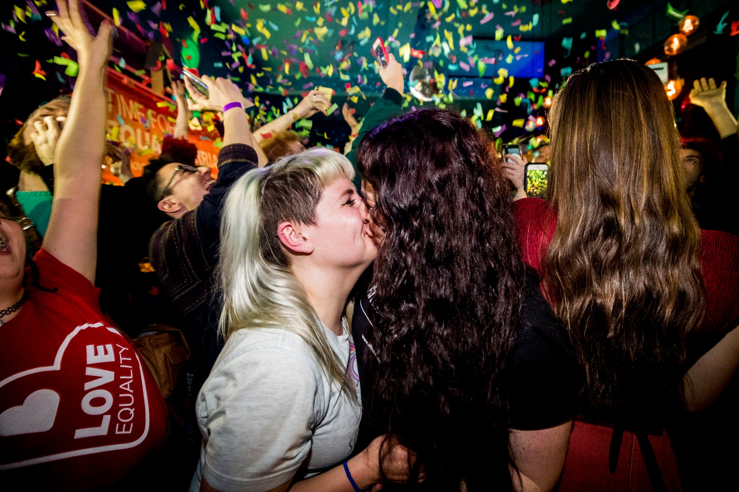 Martha Brown and her partner Louise McCullough and equal marriage supporters at Maverick Bar, Belfast, celebrate the change to abortion and same sex marriage laws in Northern Ireland at 00:01. The law passed by Westminster MPs will decriminalise abortion and pave the way for the introduction of same sex marriage in Northern Ireland