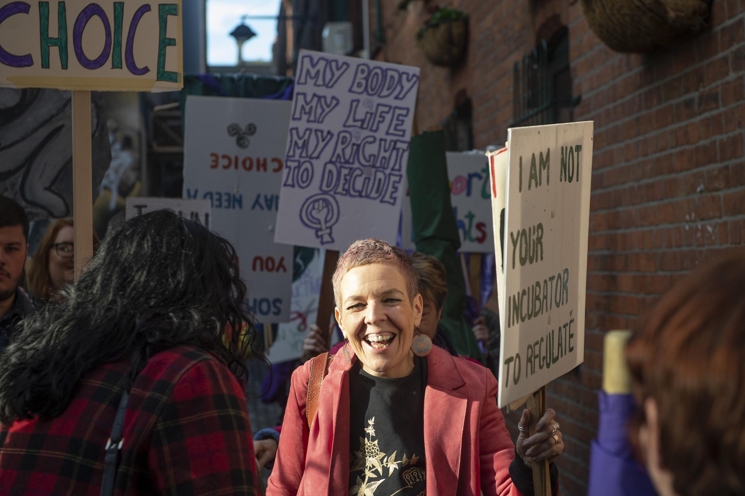 A member of pro-choice group Alliance for Choice smiled as she and others marched in support of abortion rights in Belfast, Northern Ireland, following a pro-choice press conference.