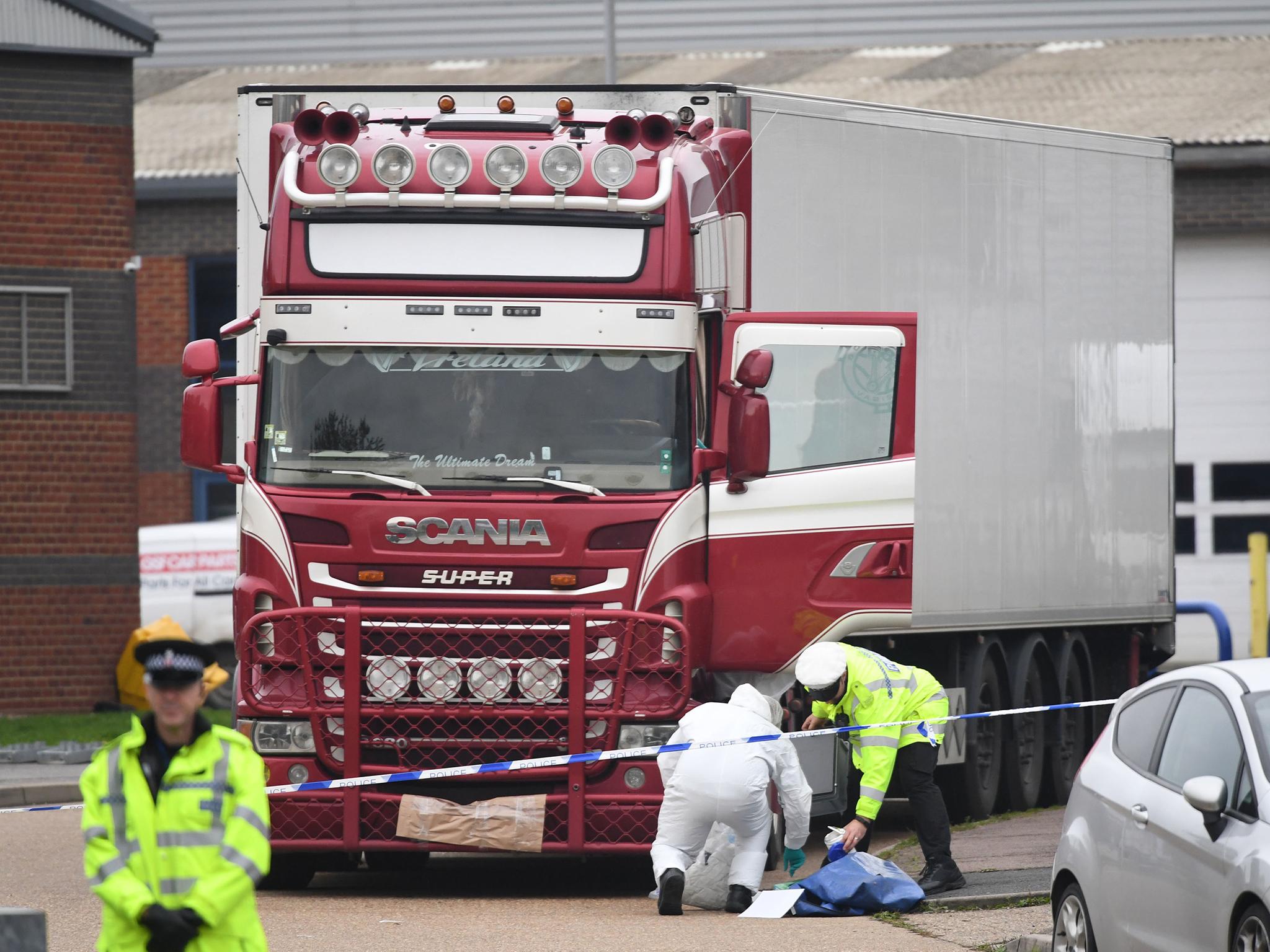 Police and forensic officers at the Waterglade Industrial Park in Grays, Essex, after 39 bodies were found inside a lorry