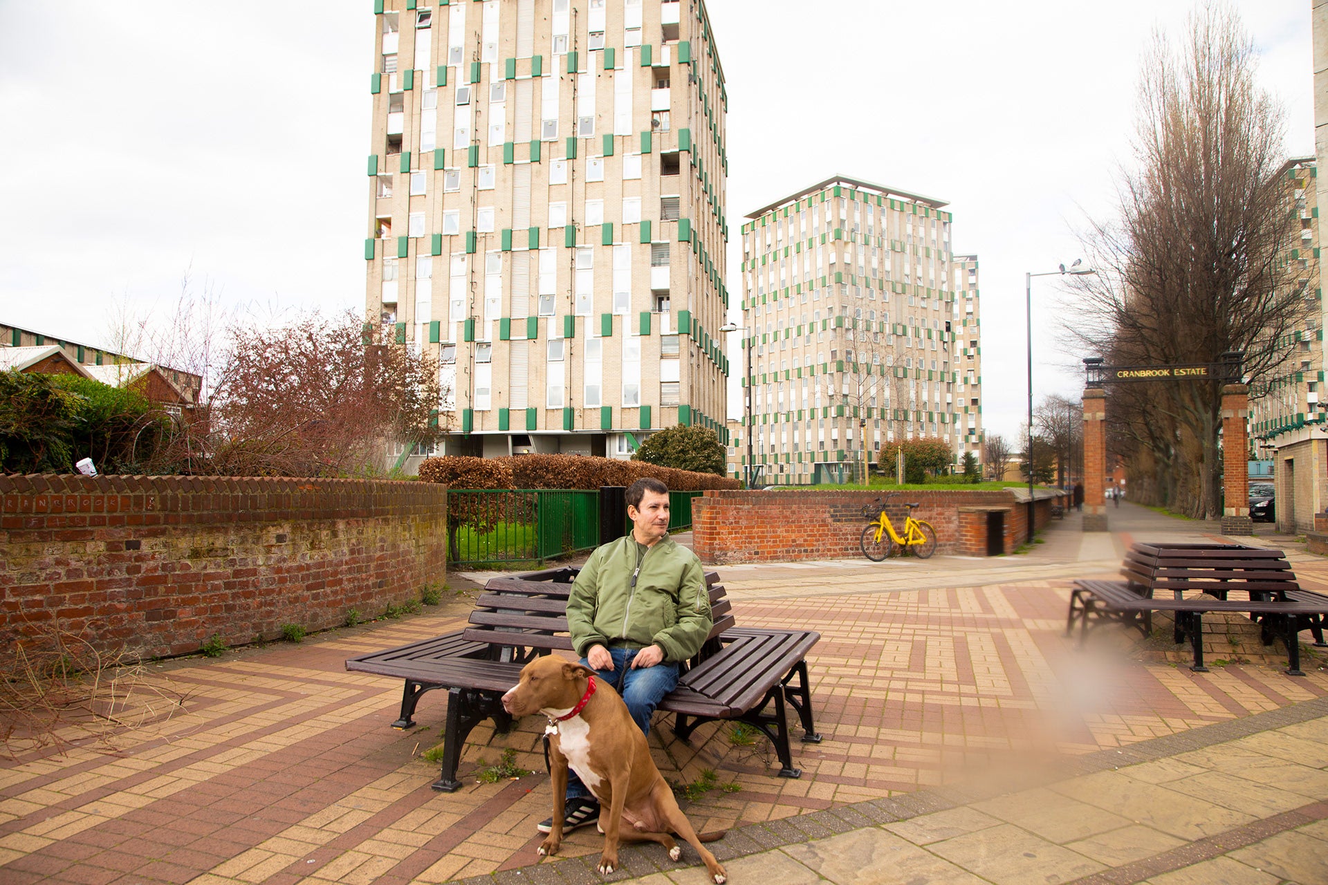 Resident with dog, Bethnal Green, 2019; part of Utopia London Council Estates photo collection by Marco Sconocchia