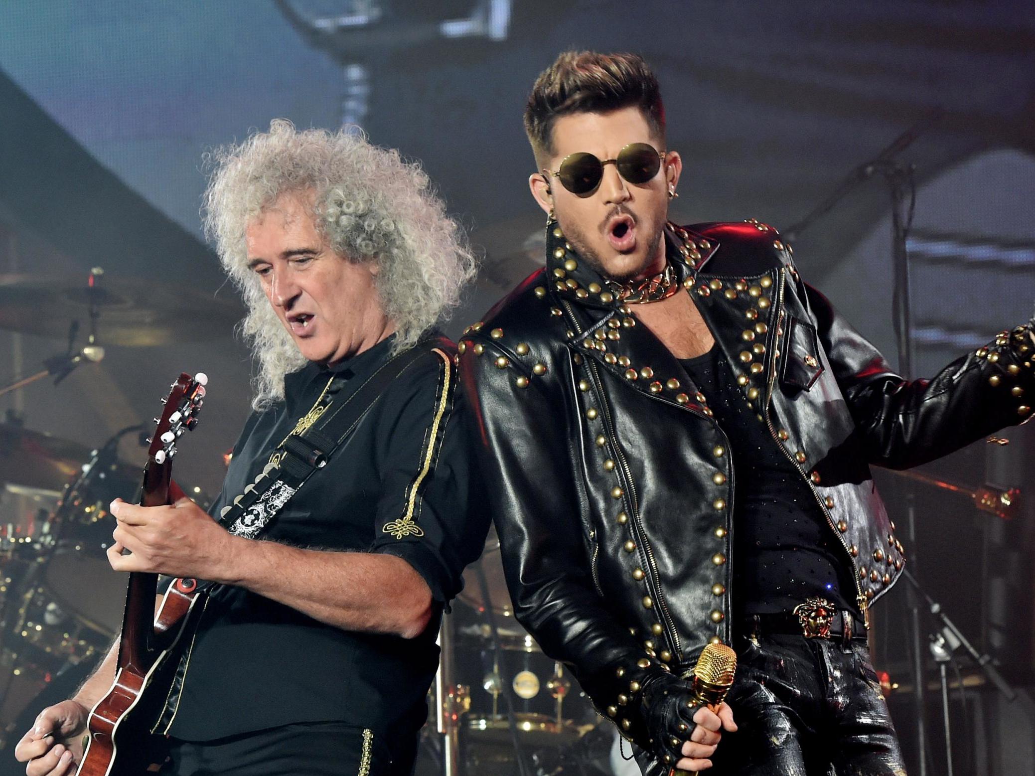 Lambert (right) has toured the world with Queen since 2014