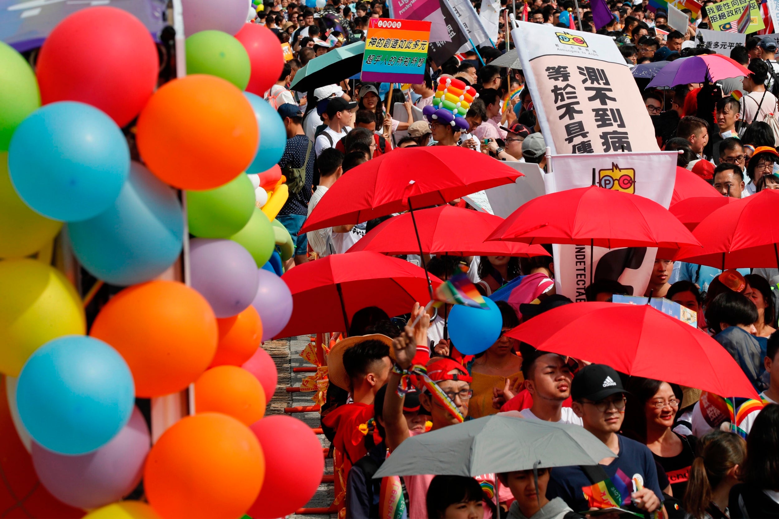 Some two hundred thousand revellers marched through Taipei in a riot of rainbow colours and celebration