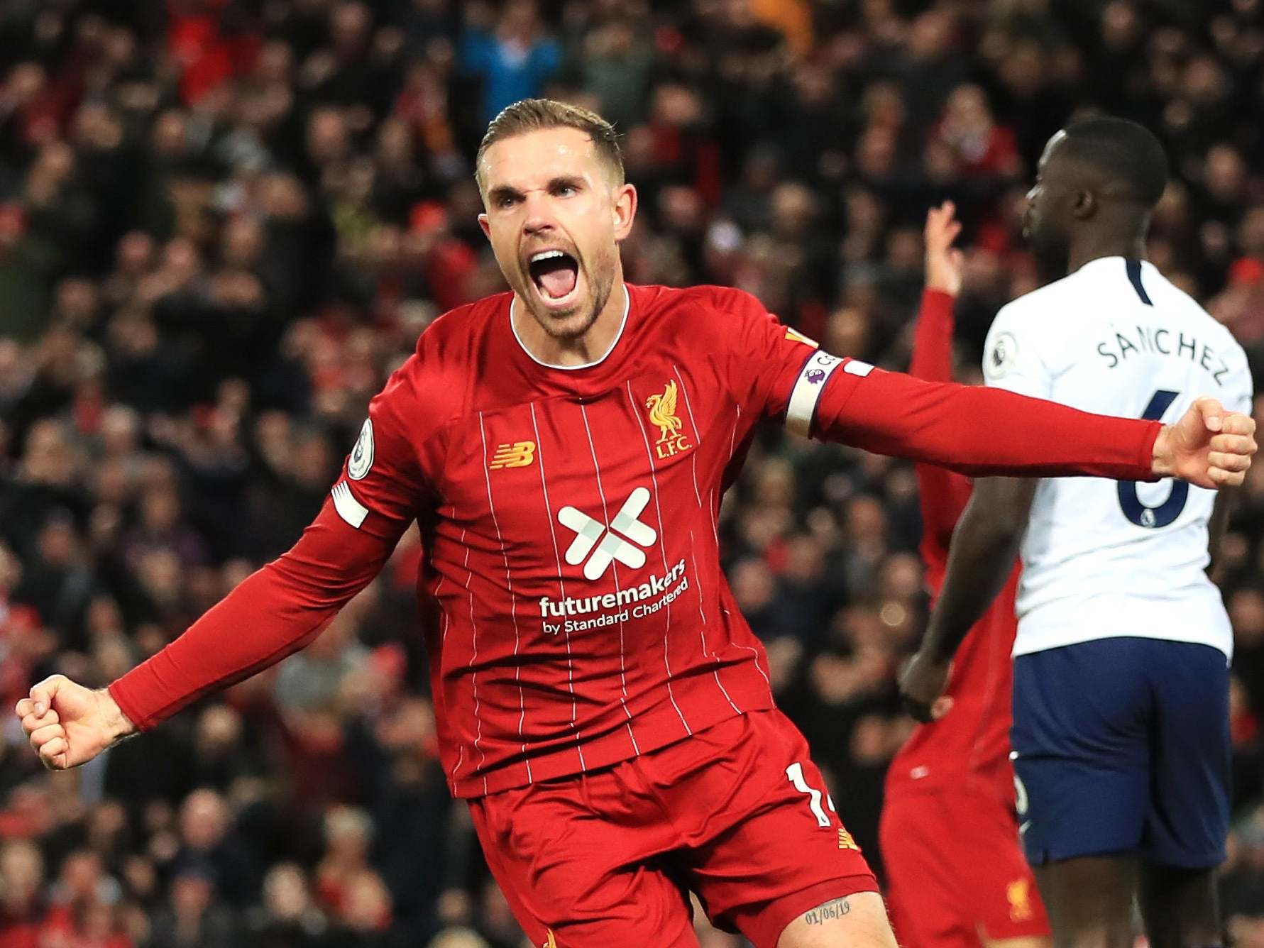 Liverpool’s Jordan Henderson celebrates scoring