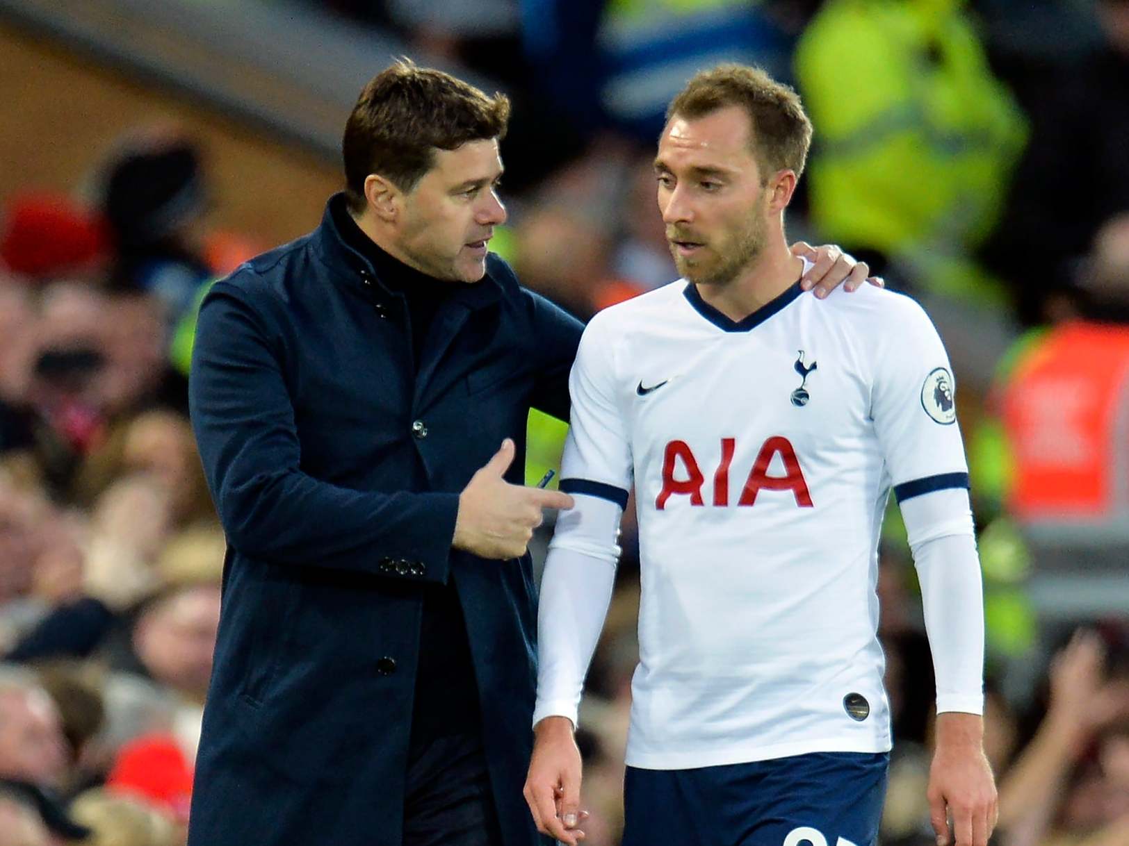 Tottenham Hotspur’s Mauricio Pochettino talks to his player Christian Eriksen