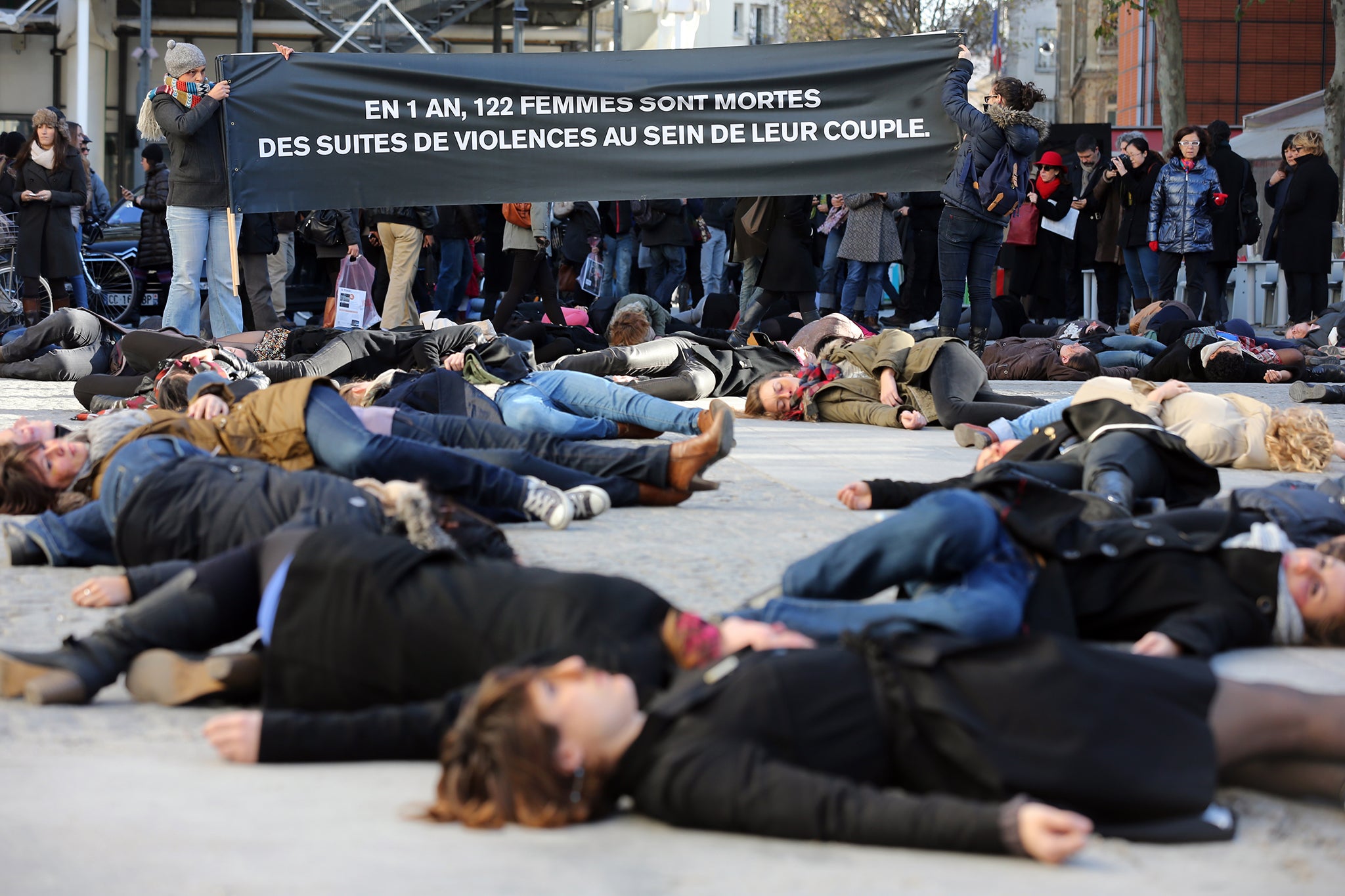 French feminists stage a ‘die-in’ in front of the Centre Pompidou during the International Day for the Elimination of Violence Against Women