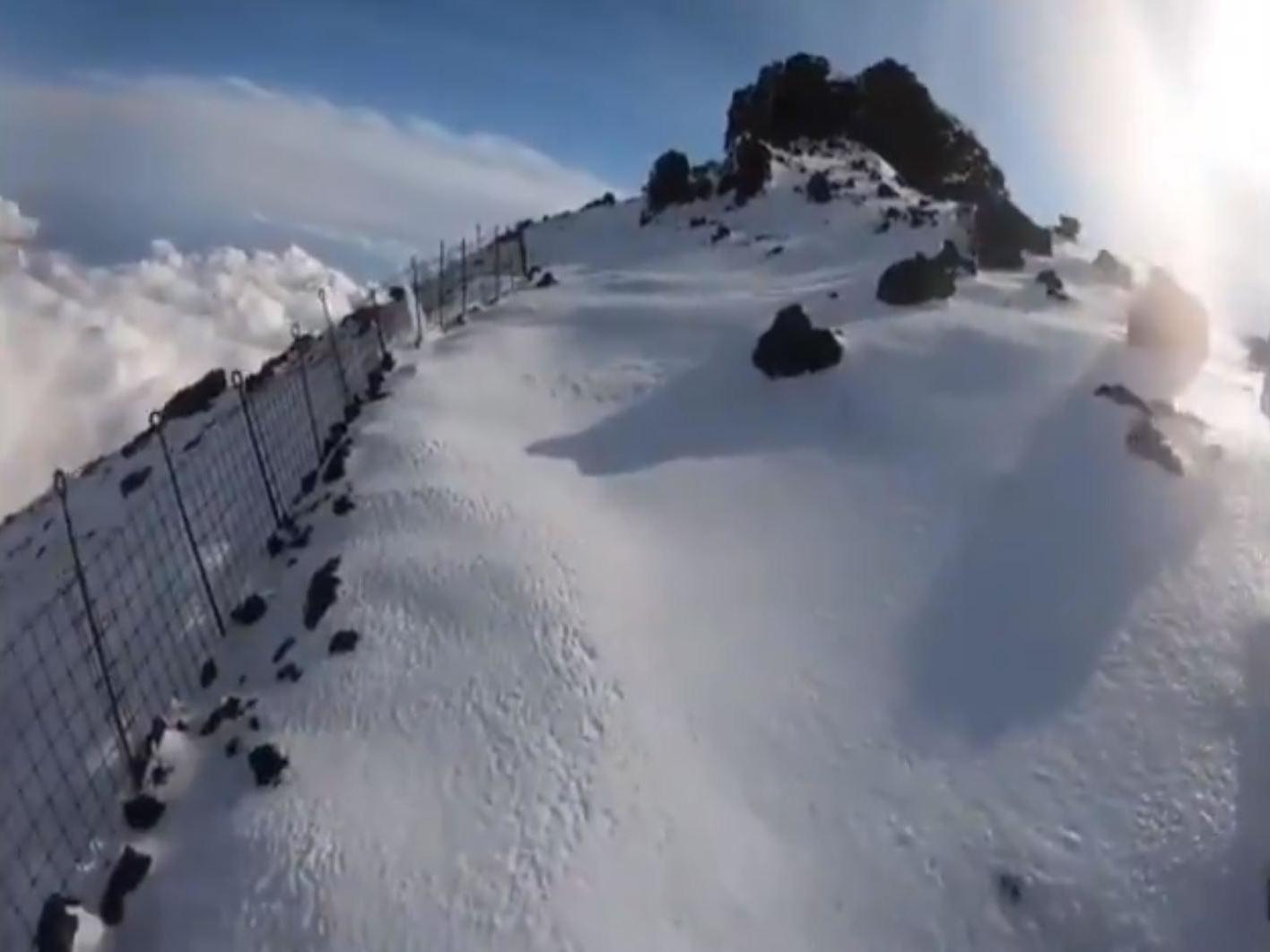 Video footage appears to show the man approaching the summit of Mount Fuji before falling