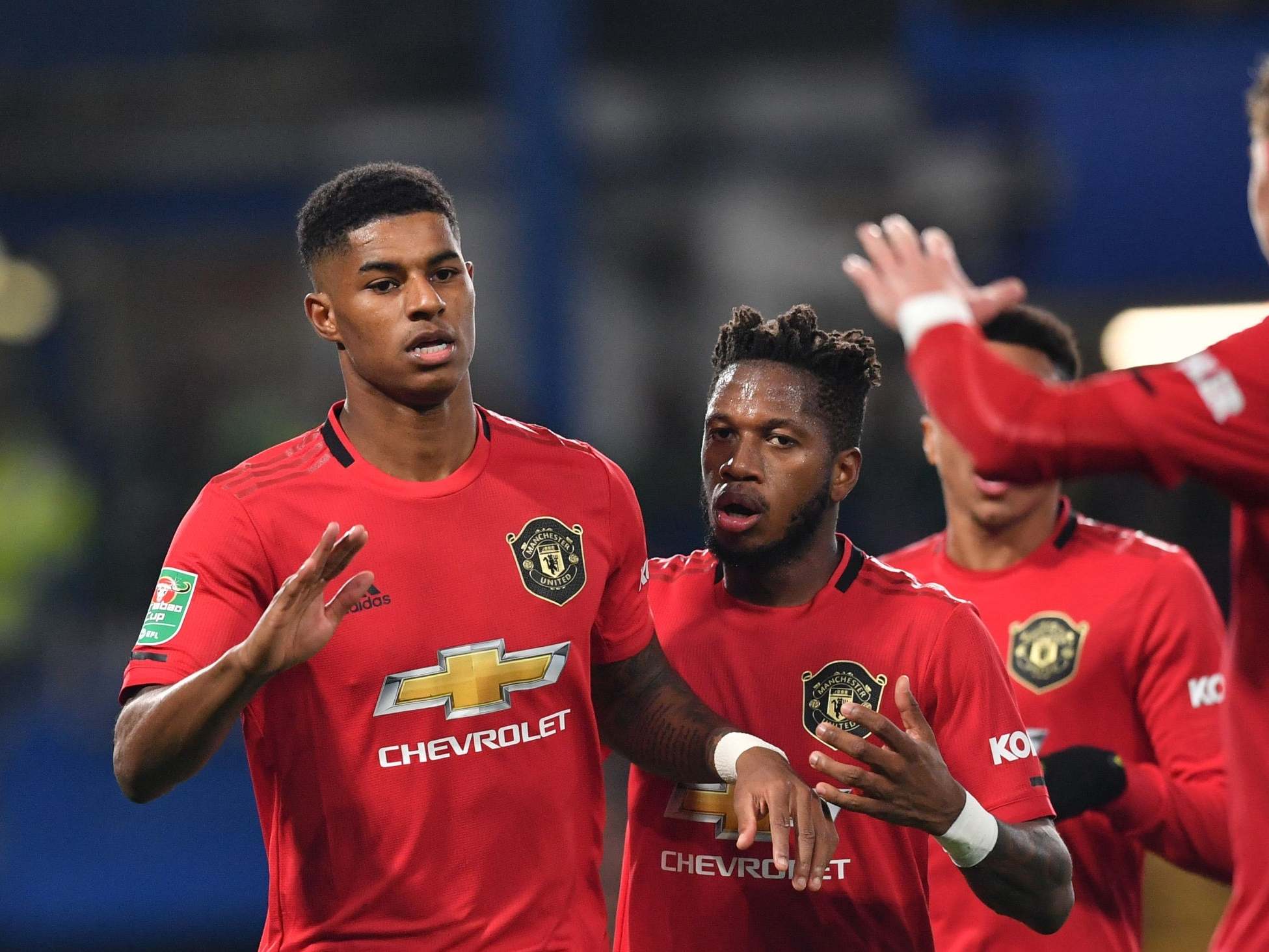 Rashford celebrates scoring his penalty