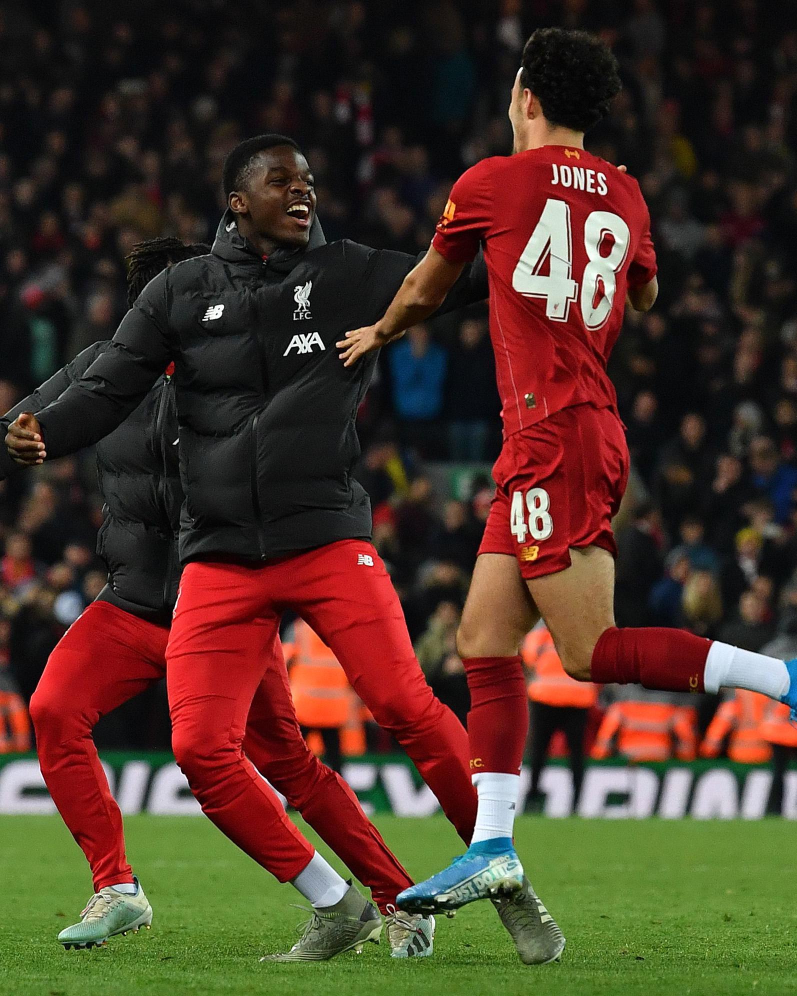 Curtis Jones celebrates his winning penalty (AFP via Getty Images)