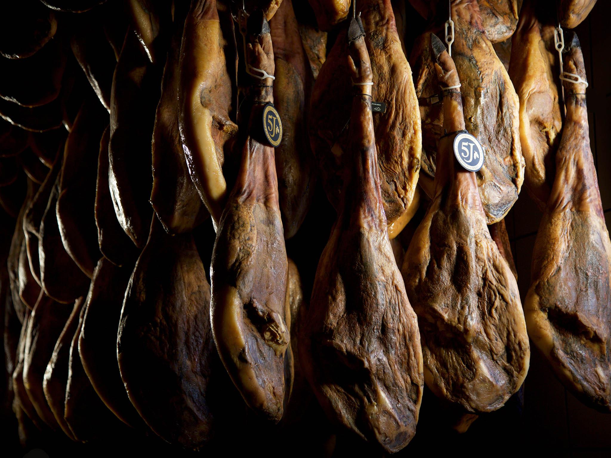 In Cinco Jotas’ cellars hams are suspended, undergoing years of salting, shaping, drying, oiling and maturing