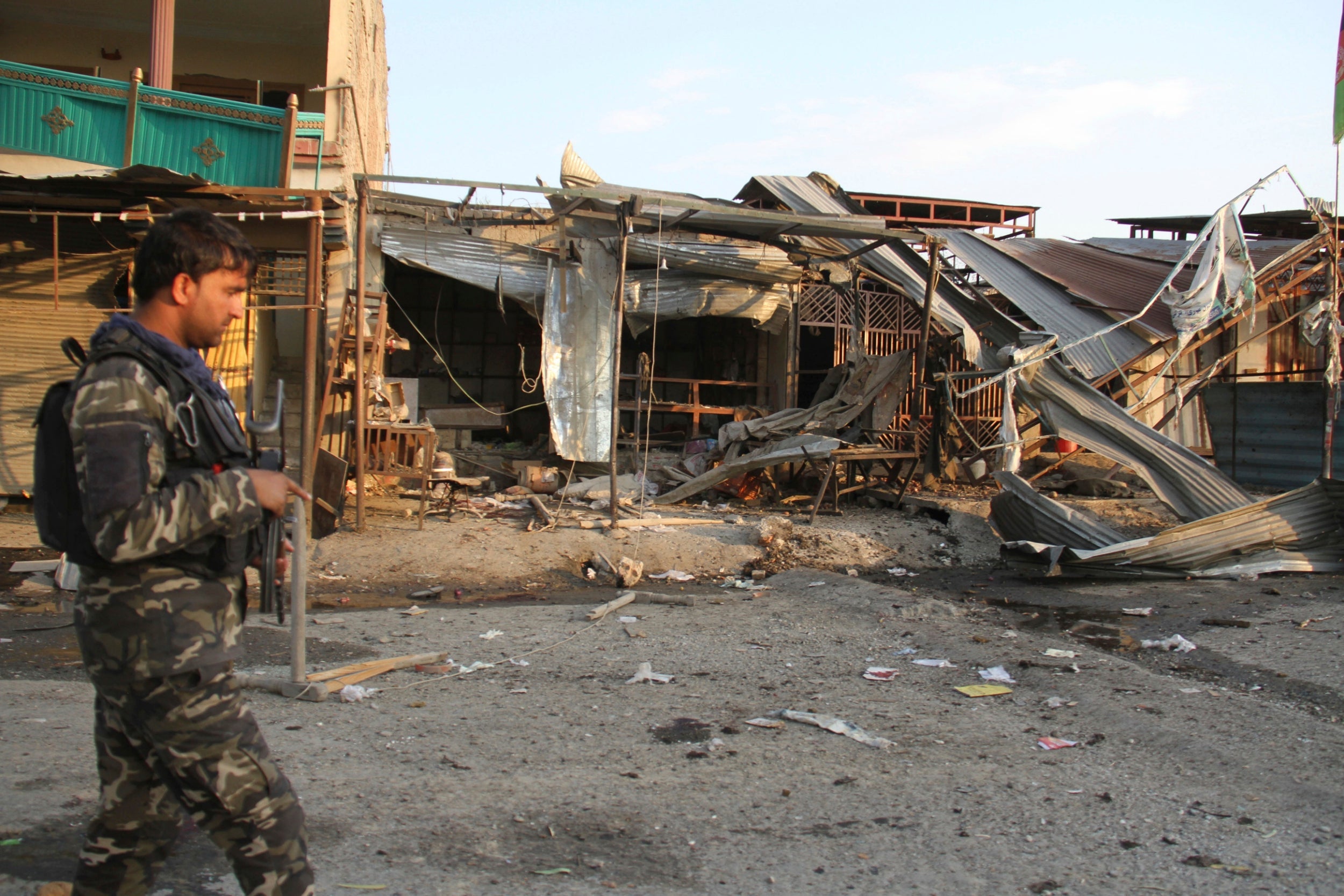 Afghan security personnel arrive at the site of a suicide attack in Jalalabad, east of Kabul, on 25 October 2019