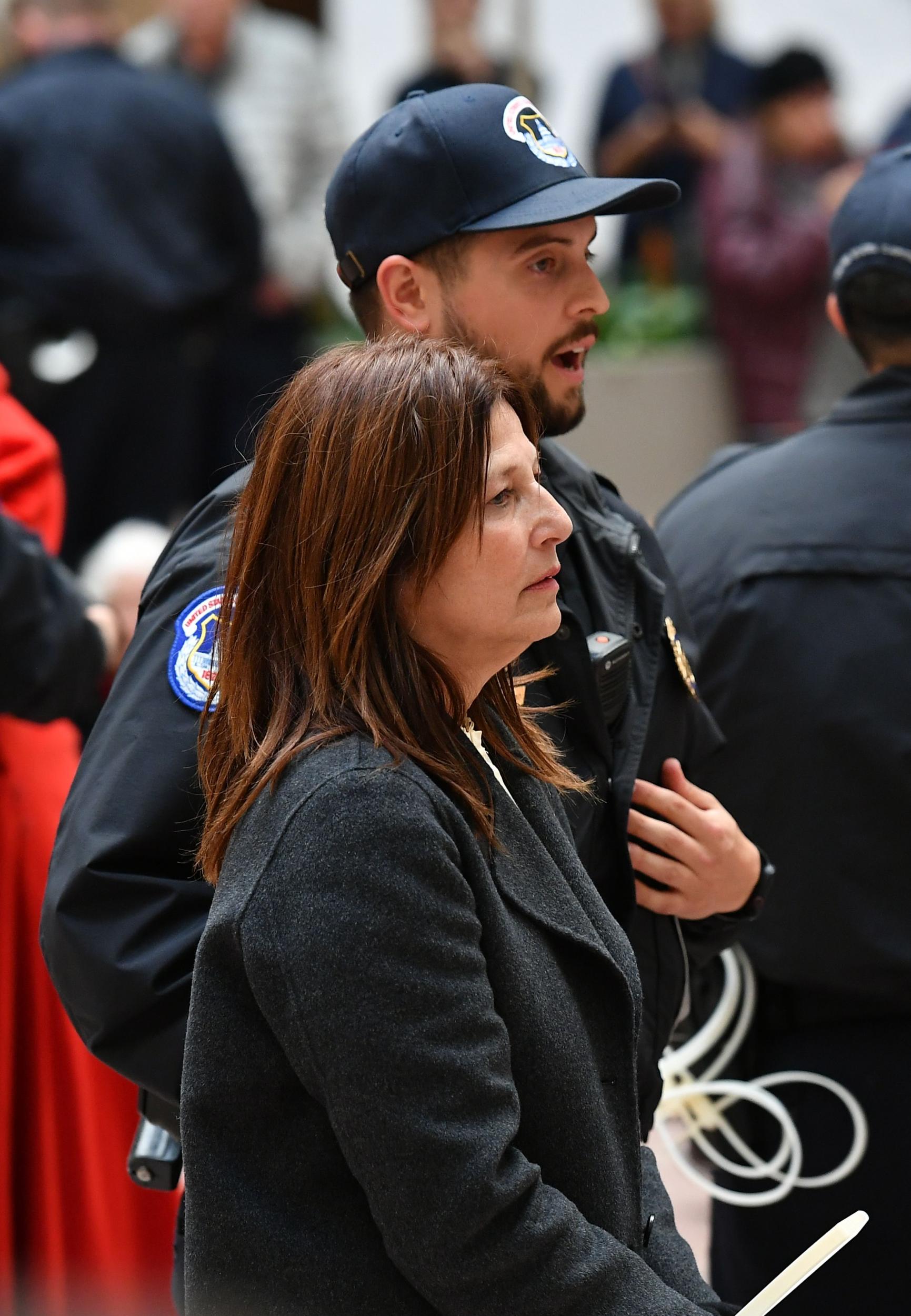 Catherine Keener is arrested by Capitol Police during a climate protest inside the Hart Senate office building on 1 November, 2019 in Washington, DC.