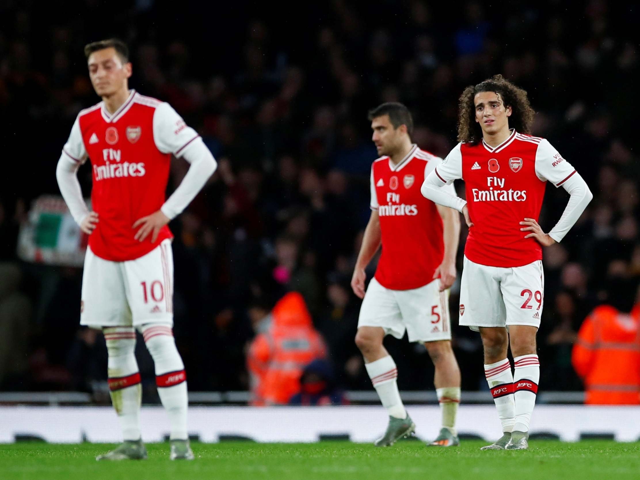 Arsenal's Matteo Guendouzi and teammates look dejected