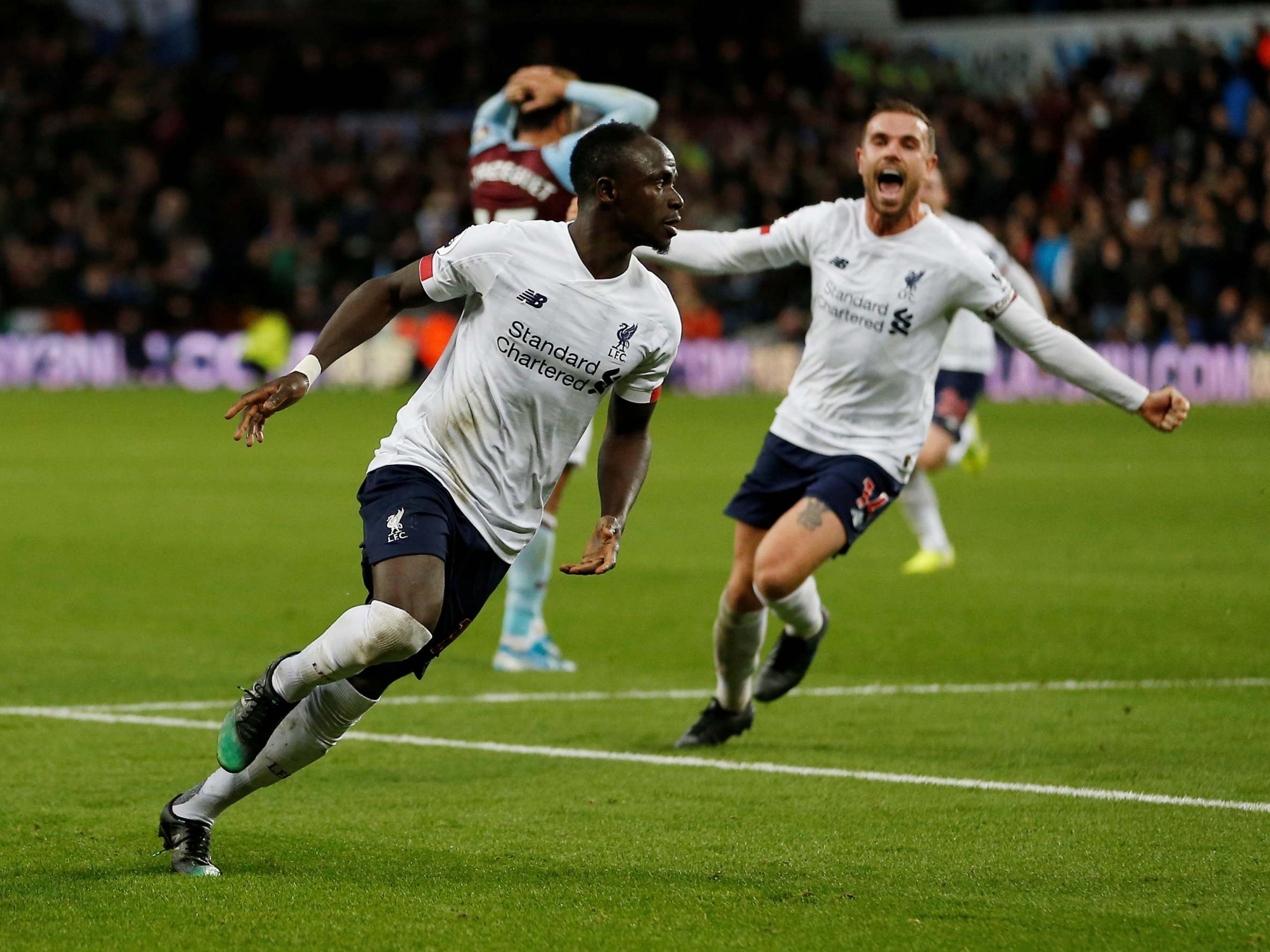 Liverpool's Sadio Mane celebrates scoring their second goal with Jordan Henderson