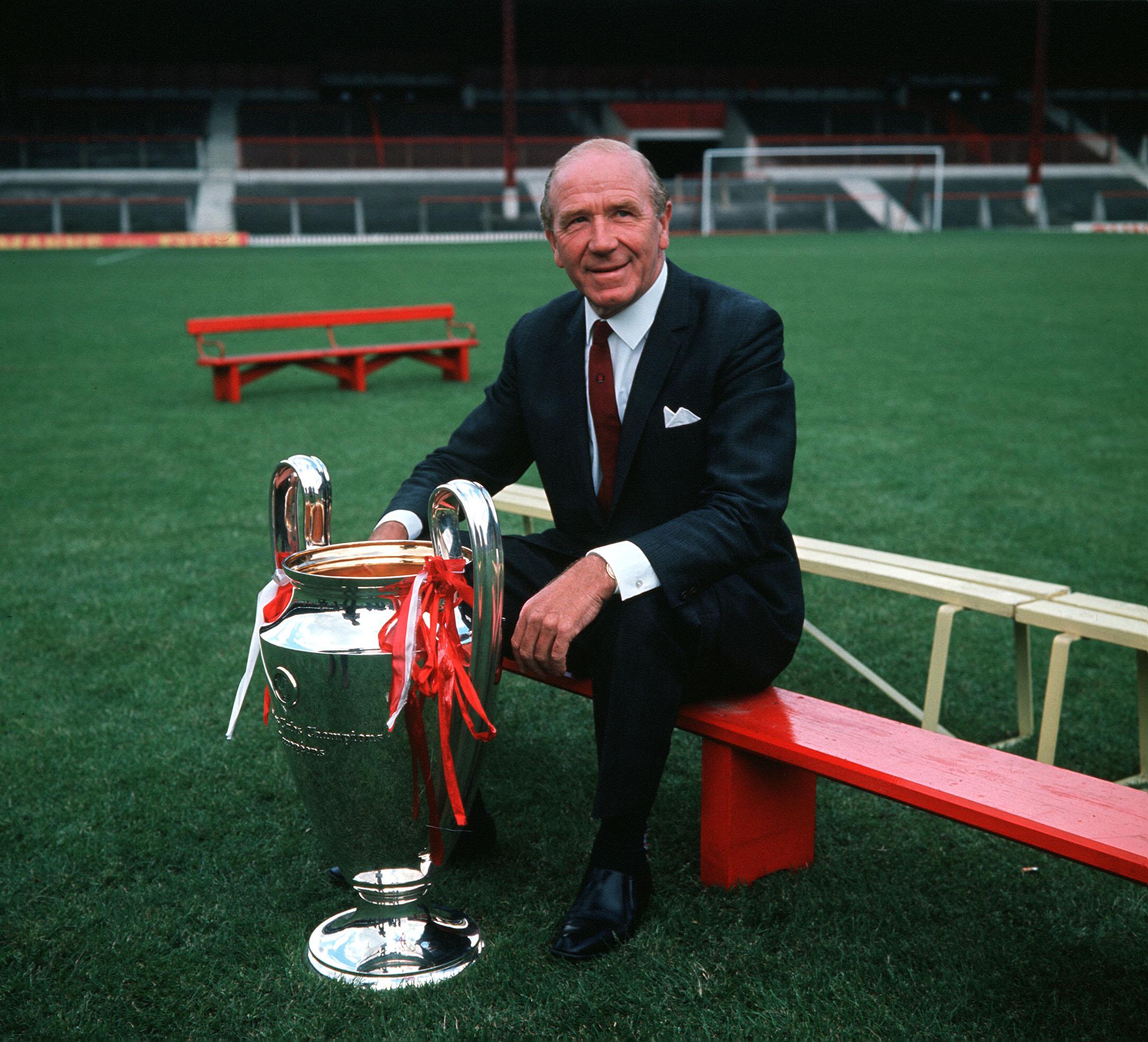 Busby posing with the European Cup