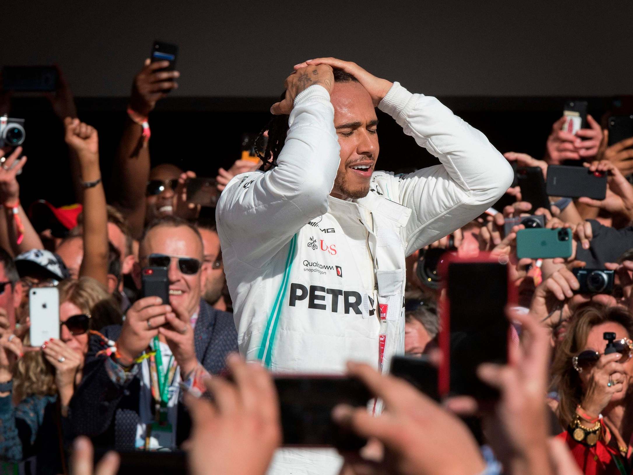 Lewis Hamilton reacts after sealing the title