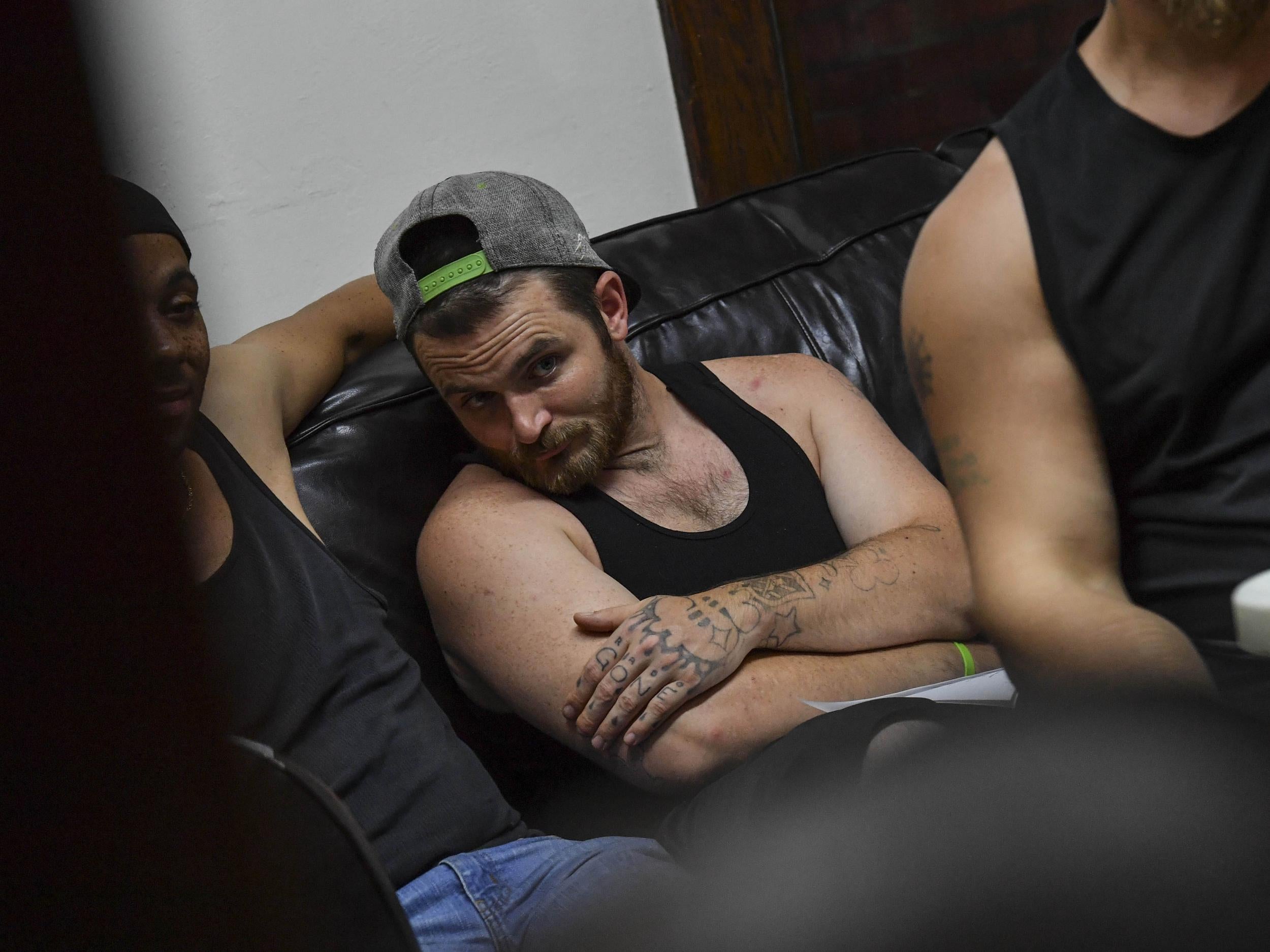 Recovering addict Stephen listens during a group meeting at the Farm