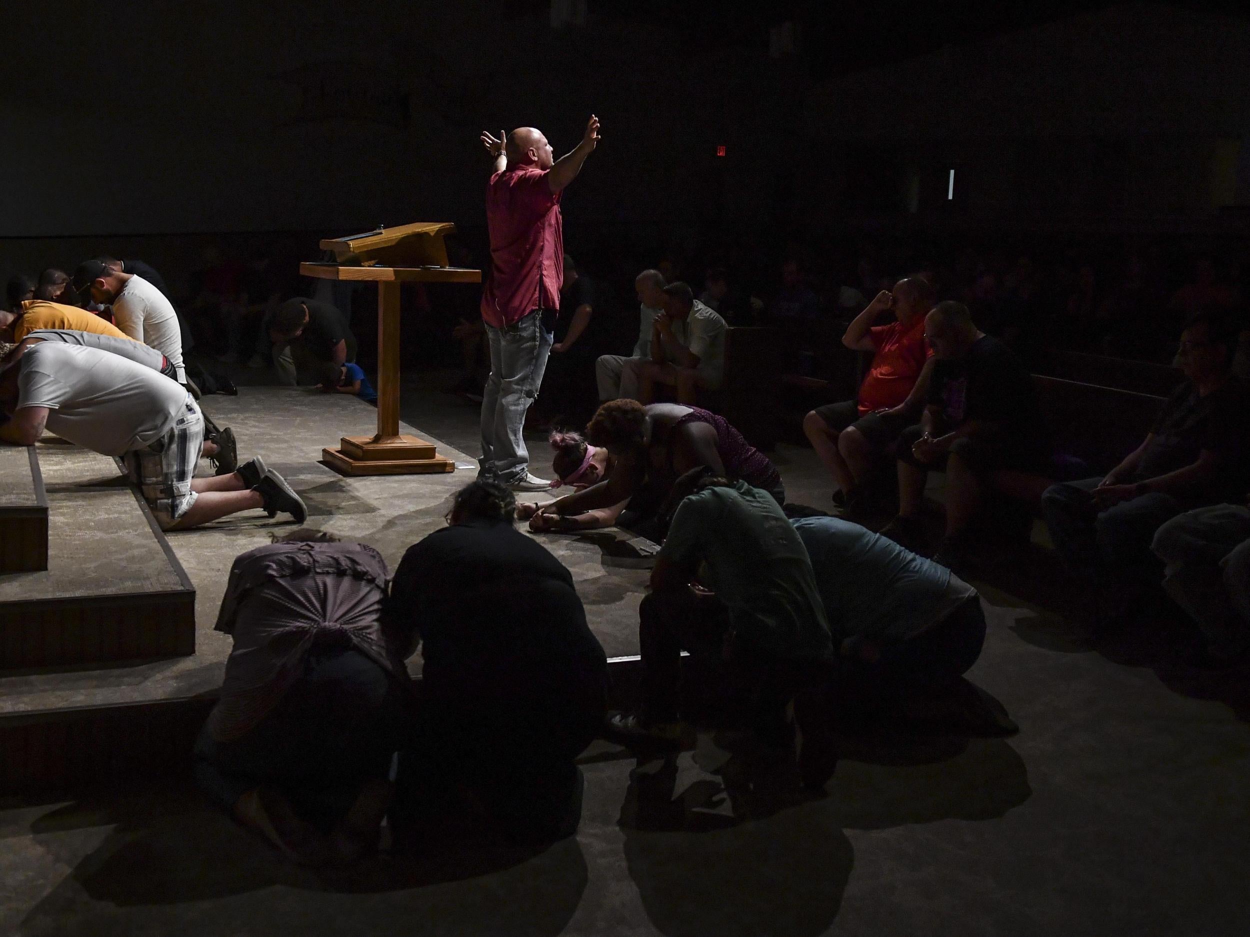 Rocky Meadows leads a prayer service for recovering addicts at the Church of Christ in Huntington