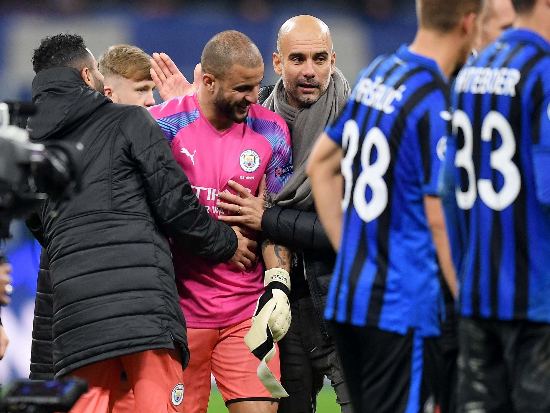 Kyle Walker of Manchester City is congratulated by Pep Guardiola