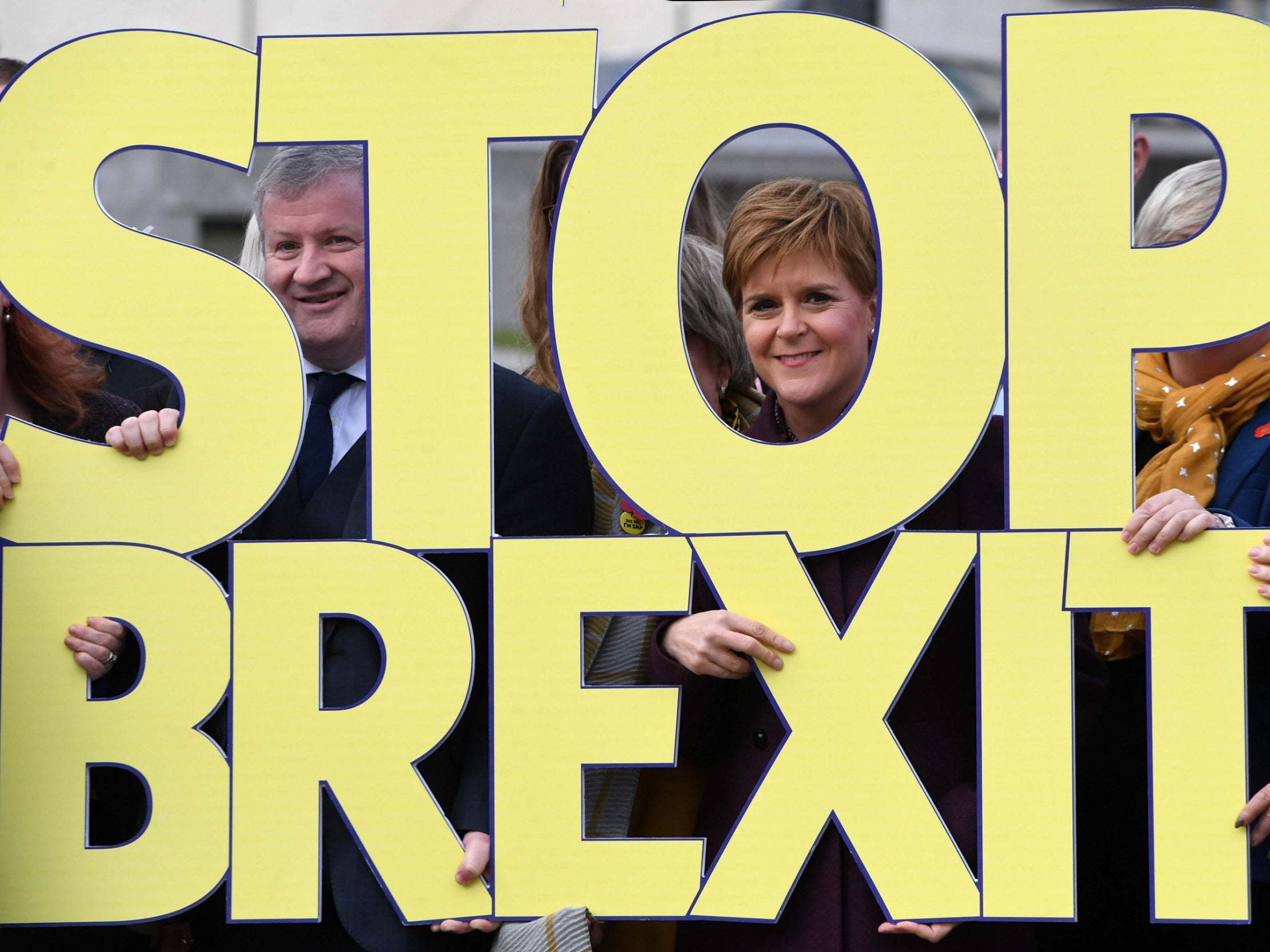 Sturgeon poses with party members to launch the SNP’s election campaign in Edinburgh (AFP/Getty)