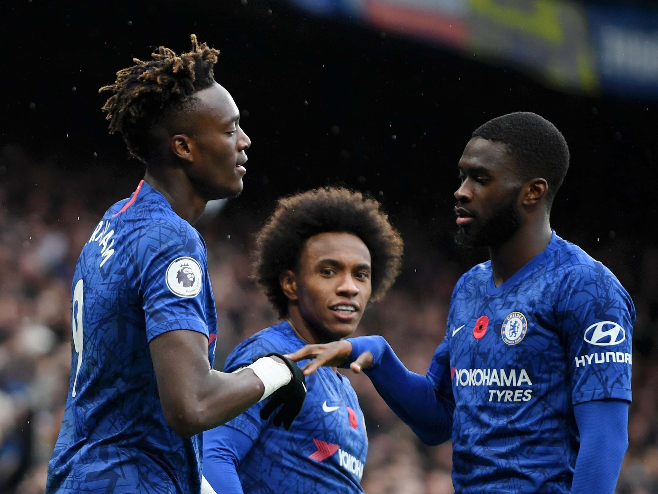 Tammy Abraham of Chelsea celebrates with teammate Fikayo Tomori