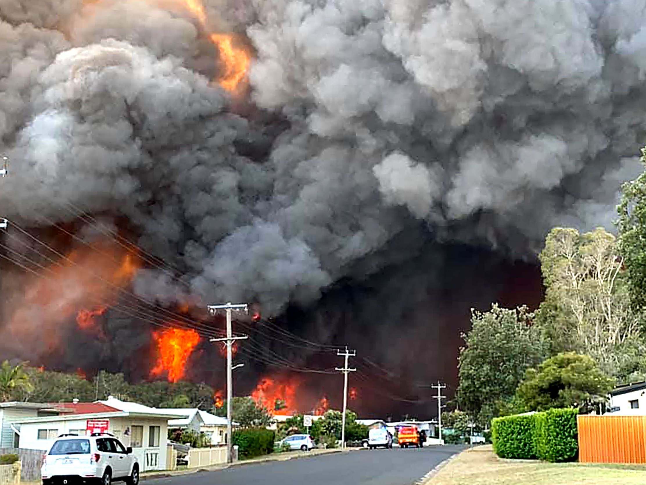 A bushfire seen from a nearby residential area in Harrington, about 335 kilometres northeast of Sydney, 8 November, 2019.