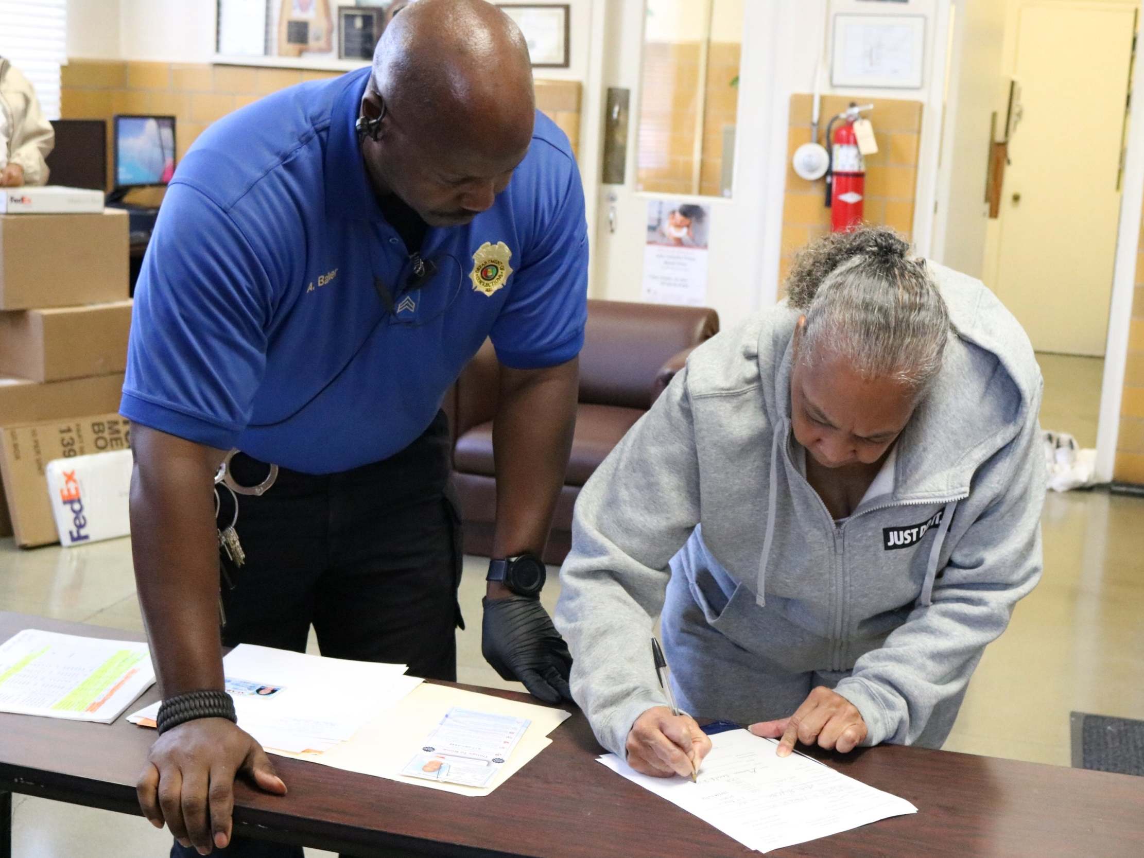 Grandmother Geneva Cooley signs papers to be released from Julia Tutwiler Prison