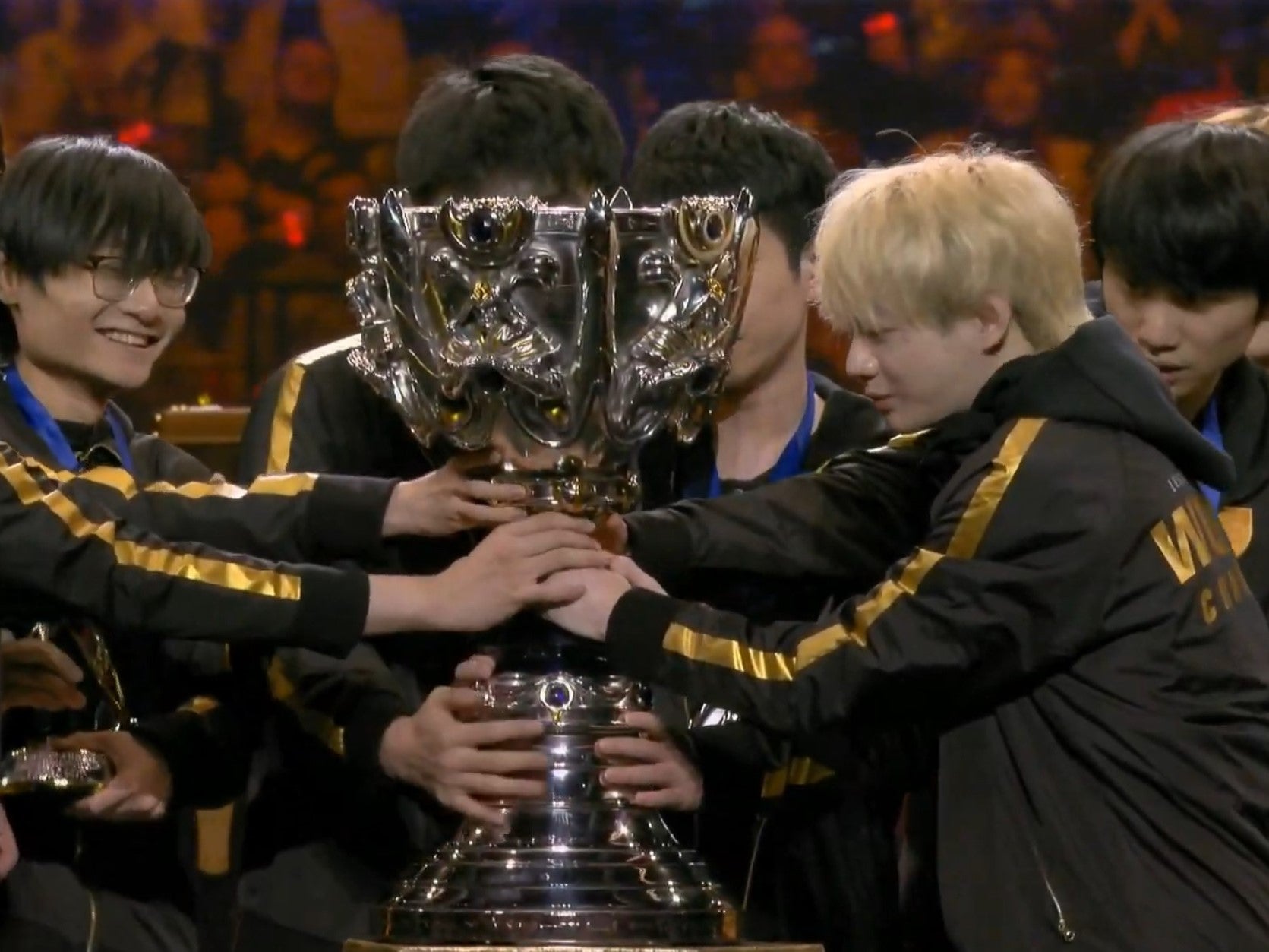 Chinese team FPX lift the Summoner's Cup after winning the 2019 League of Legends World Championship finals