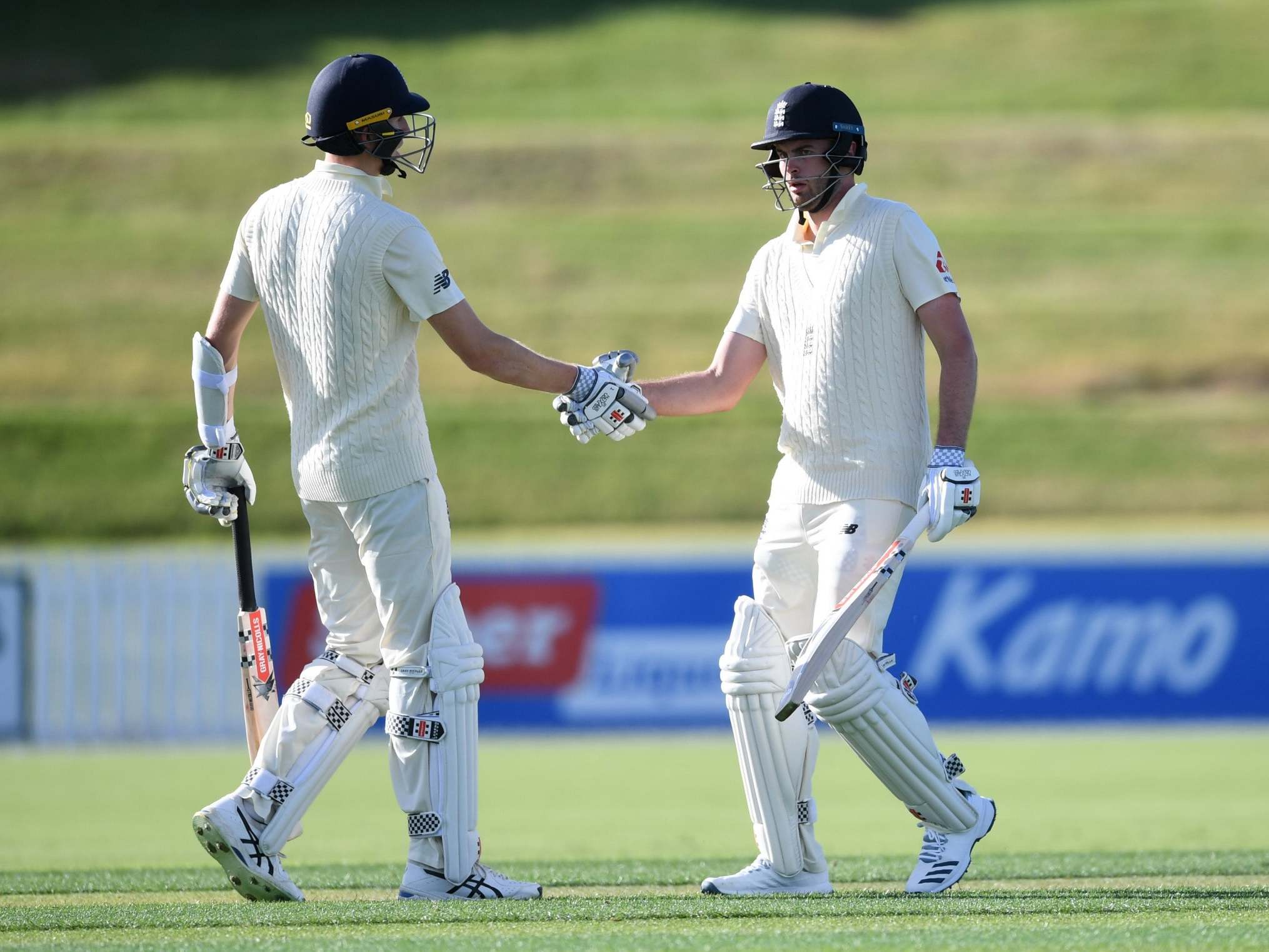 Dom Sibley celebrates with Zak Crawley after reaching his century