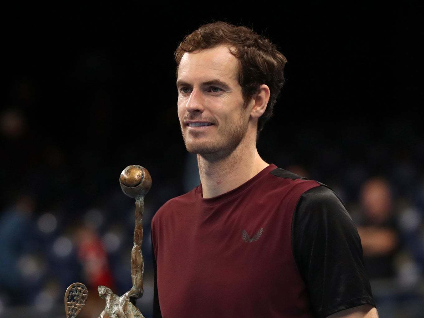 Andy Murray poses with the trophy after victory in Antwerp