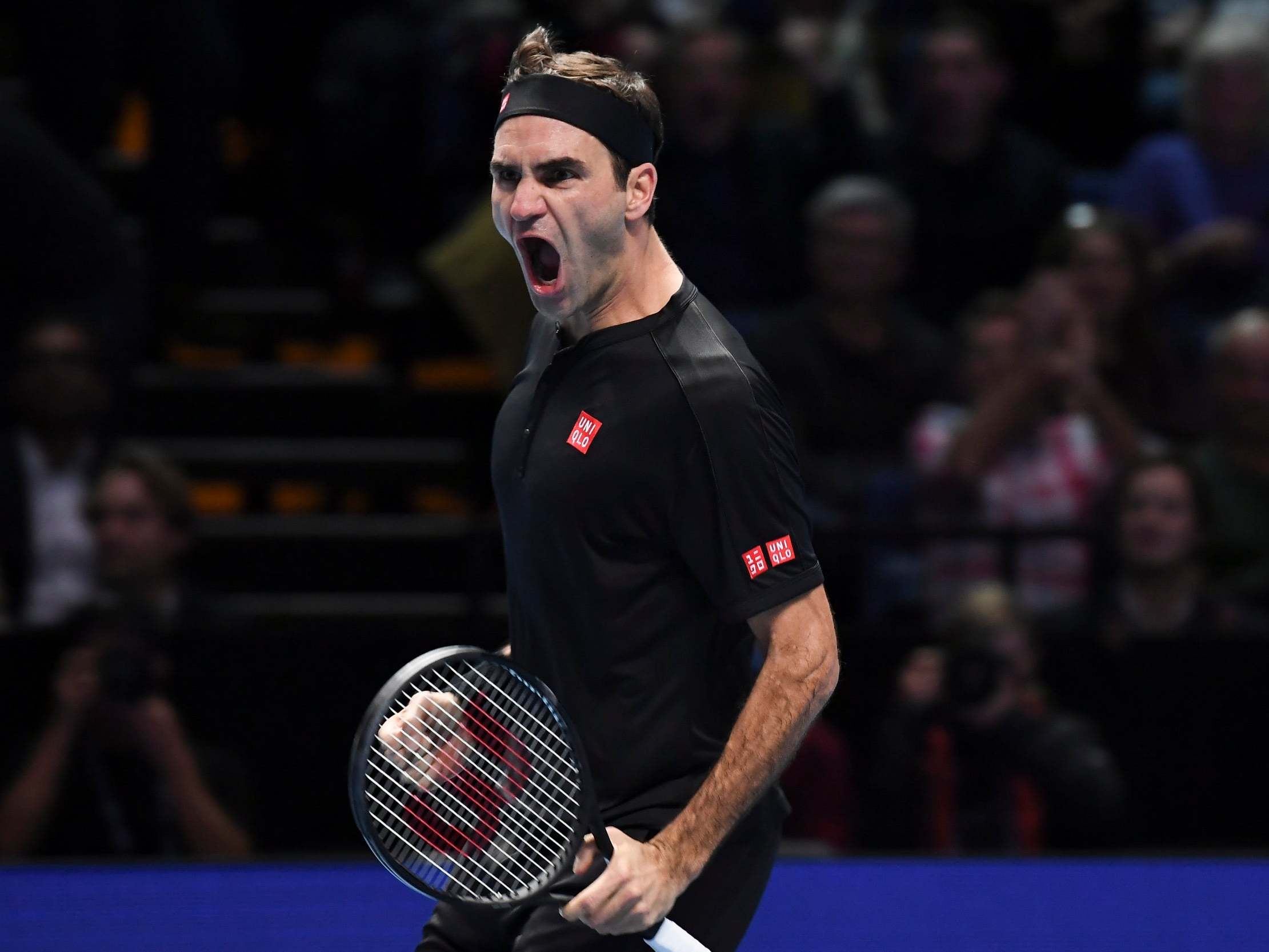 Roger Federer celebrates during the match