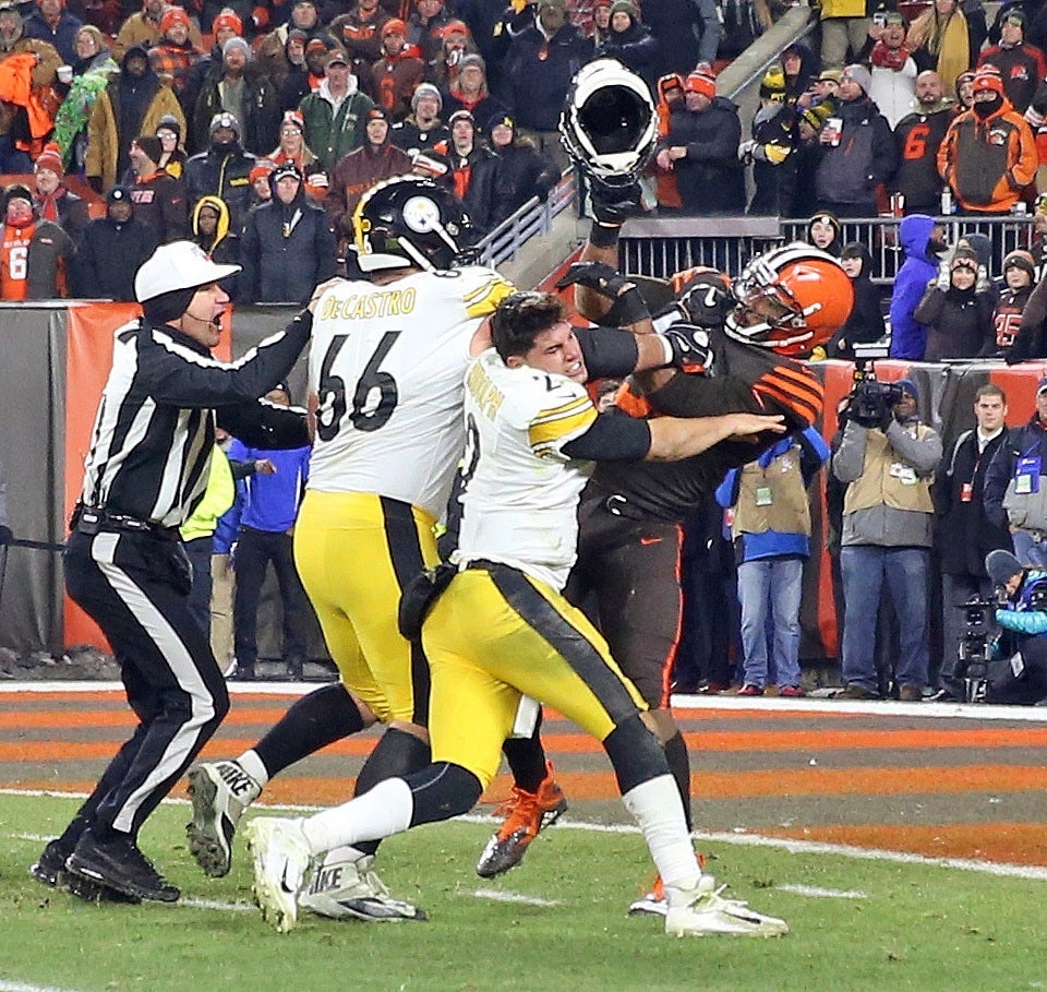 Garrett smashed Rudolph over the head with his own helmet