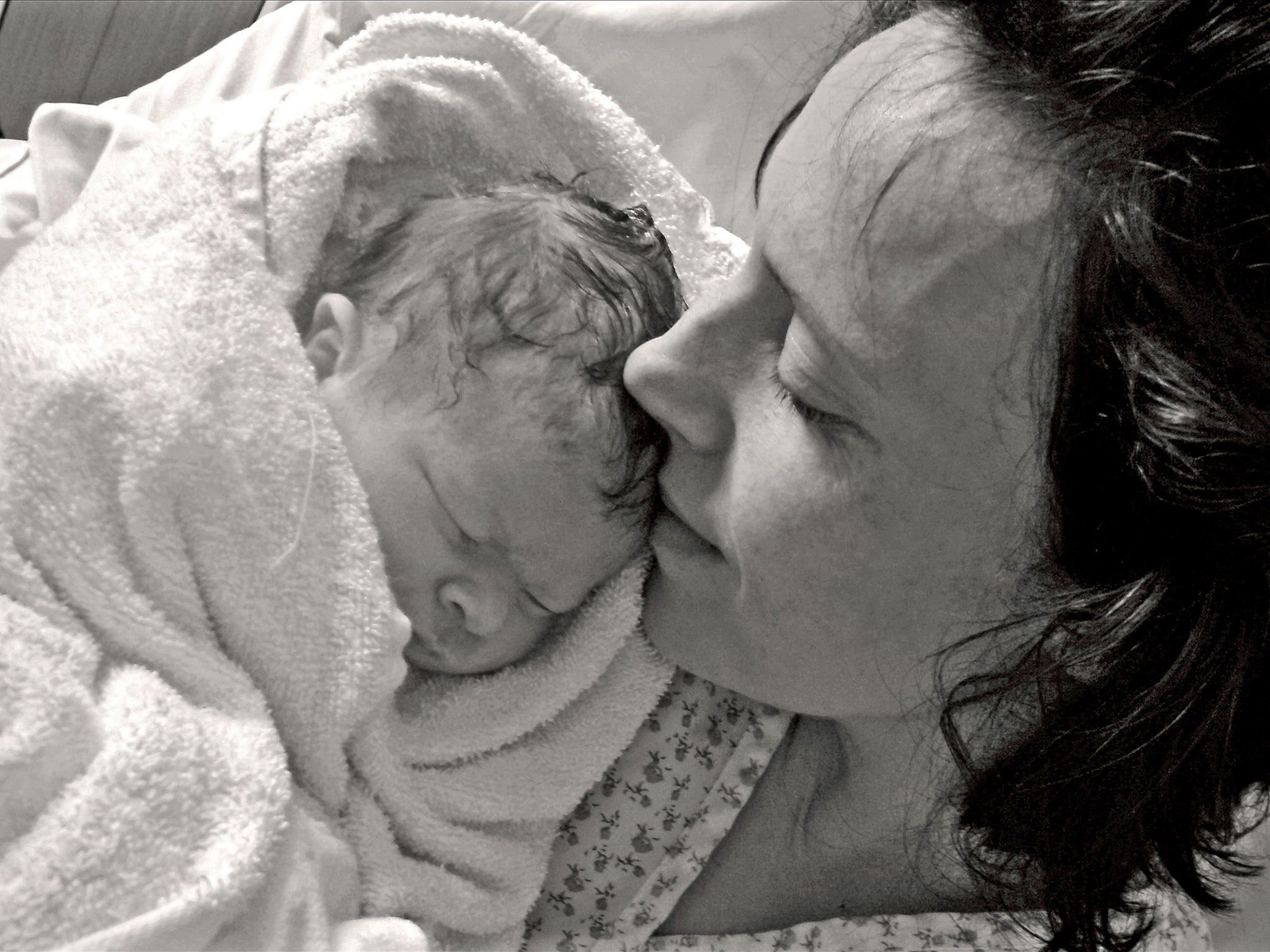 Rhiannon Davies holds her daughter Kate, who died six hours after being born