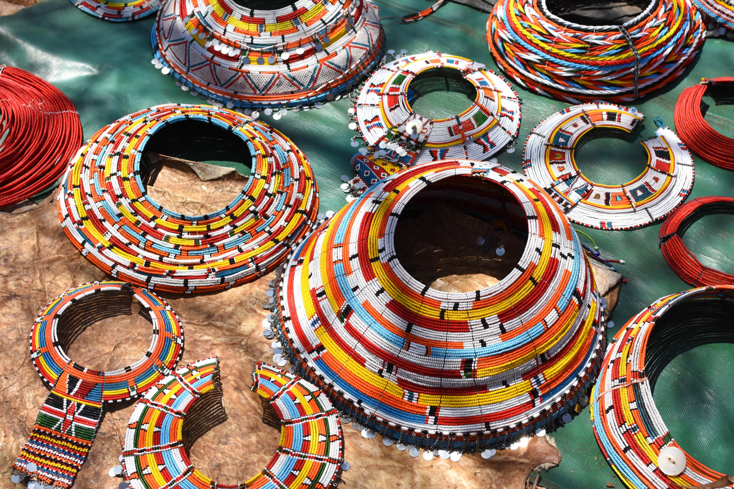 The women of Kirish sell beadwork to tourists