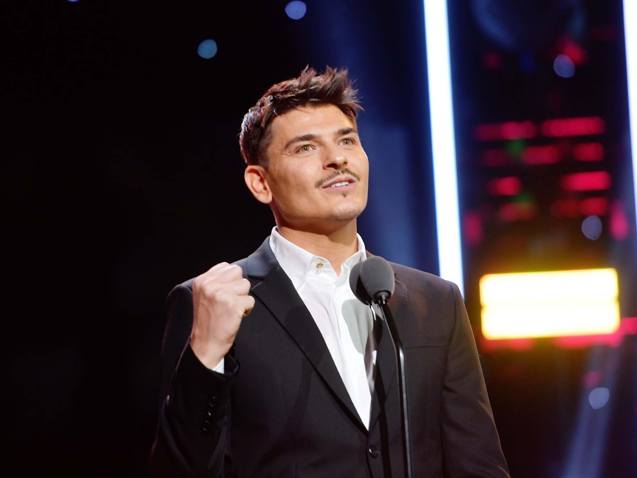 Mario Dedivanovic accepts the Artist Achievement Award at the American Influencer Awards in Los Angeles