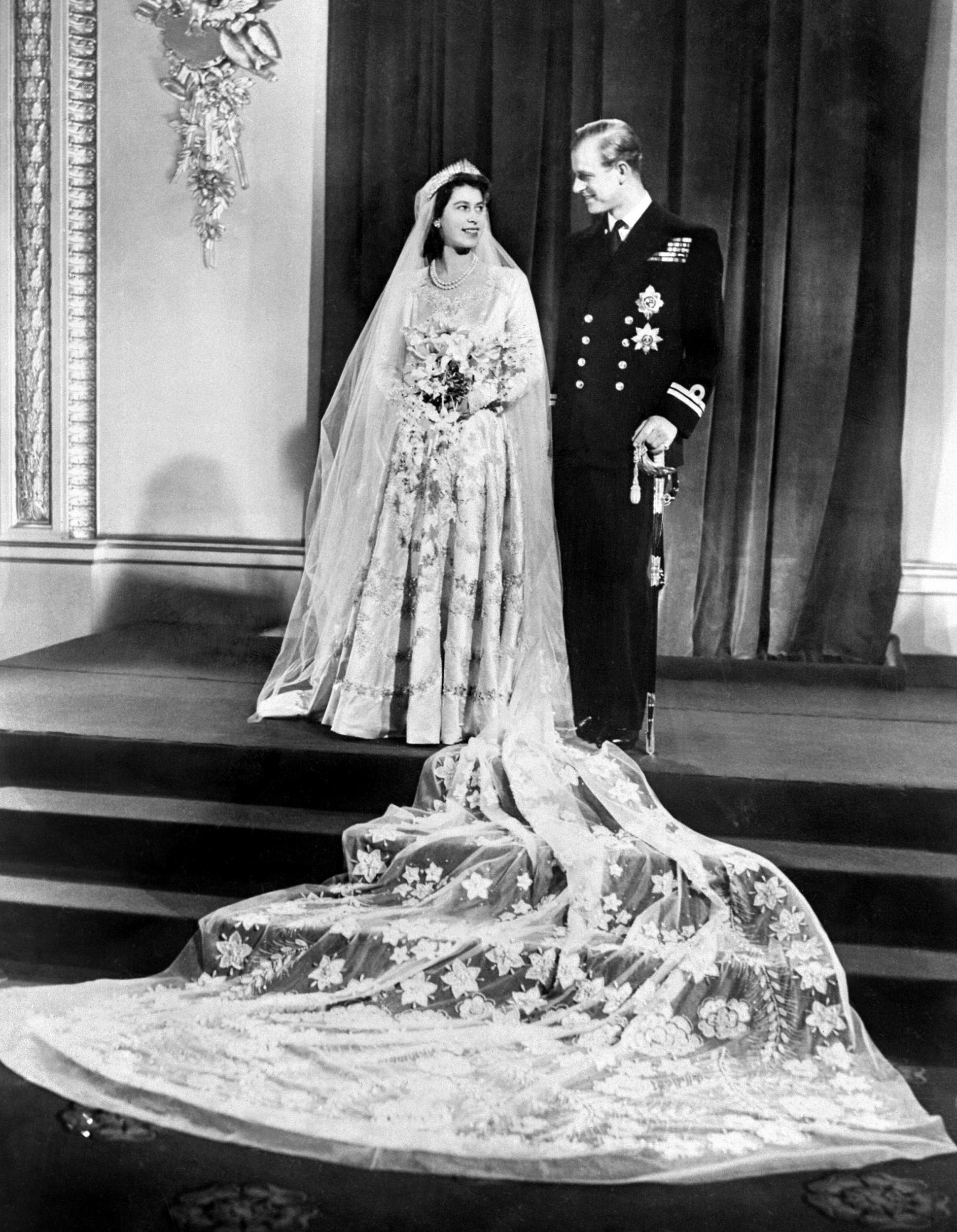 The future Queen Elizabeth II and Philip, Duke of Edinburgh are photographed together on their wedding day at Buckingham Palace (20 November 1947)