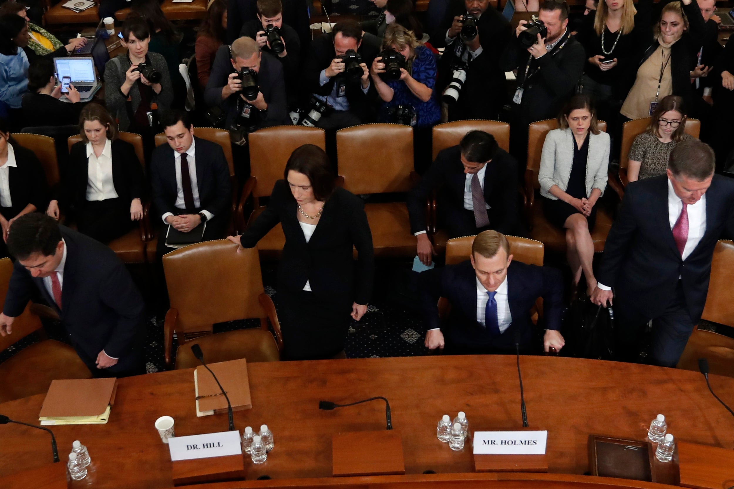 Fiona Hill and David Holmes take their seats before giving evidence at the public impeachment hearings into Donald Trump