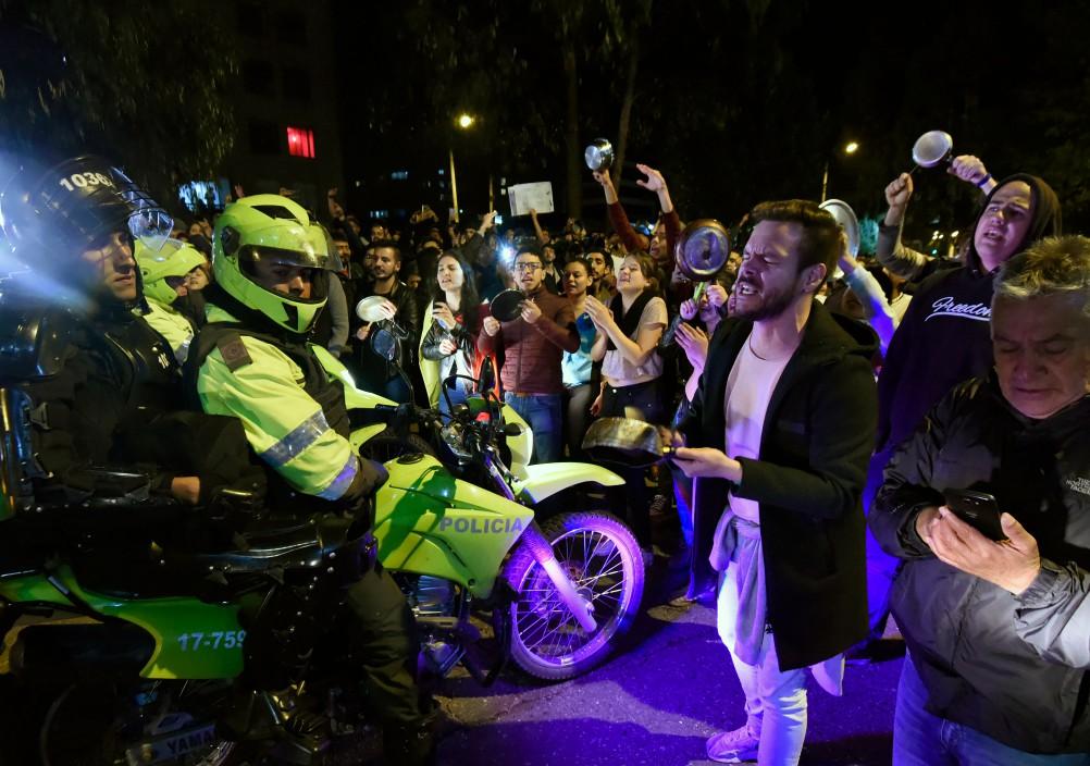 People bang pans during protests in front of the house of Colombia's President Ivan Duque, in Bogota