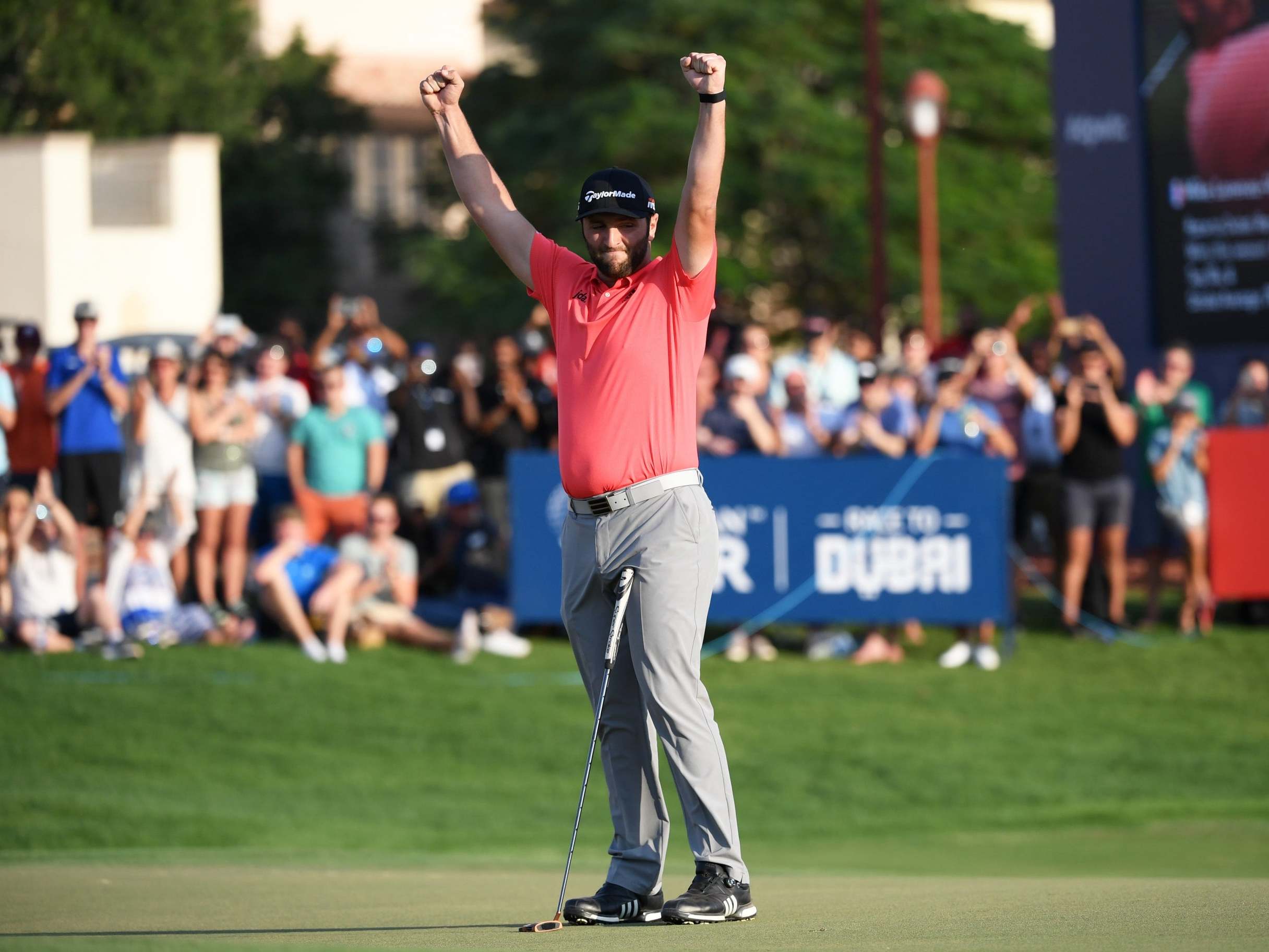 Jon Rahm celebrates on the 18th green