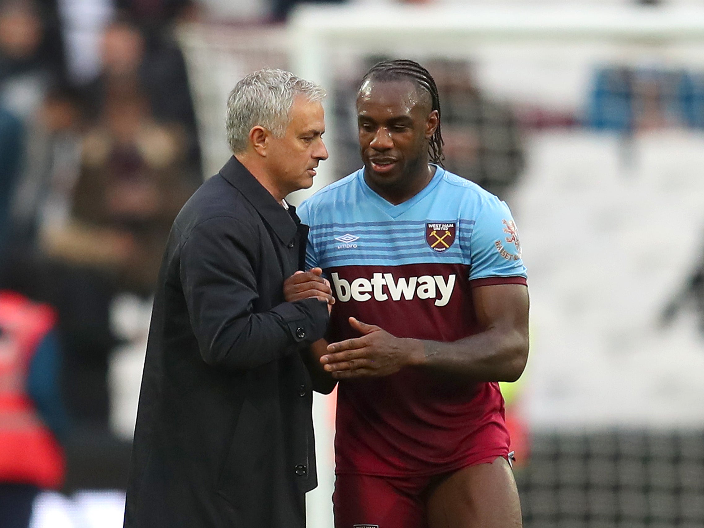 Michail Antonio speaks with Jose Mourinho after the match