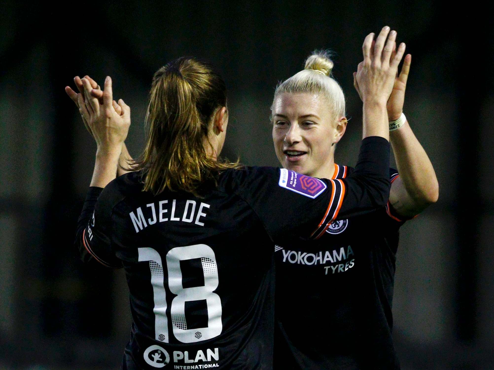 England celebrates with Mjelde as Chelsea beat Birmingham