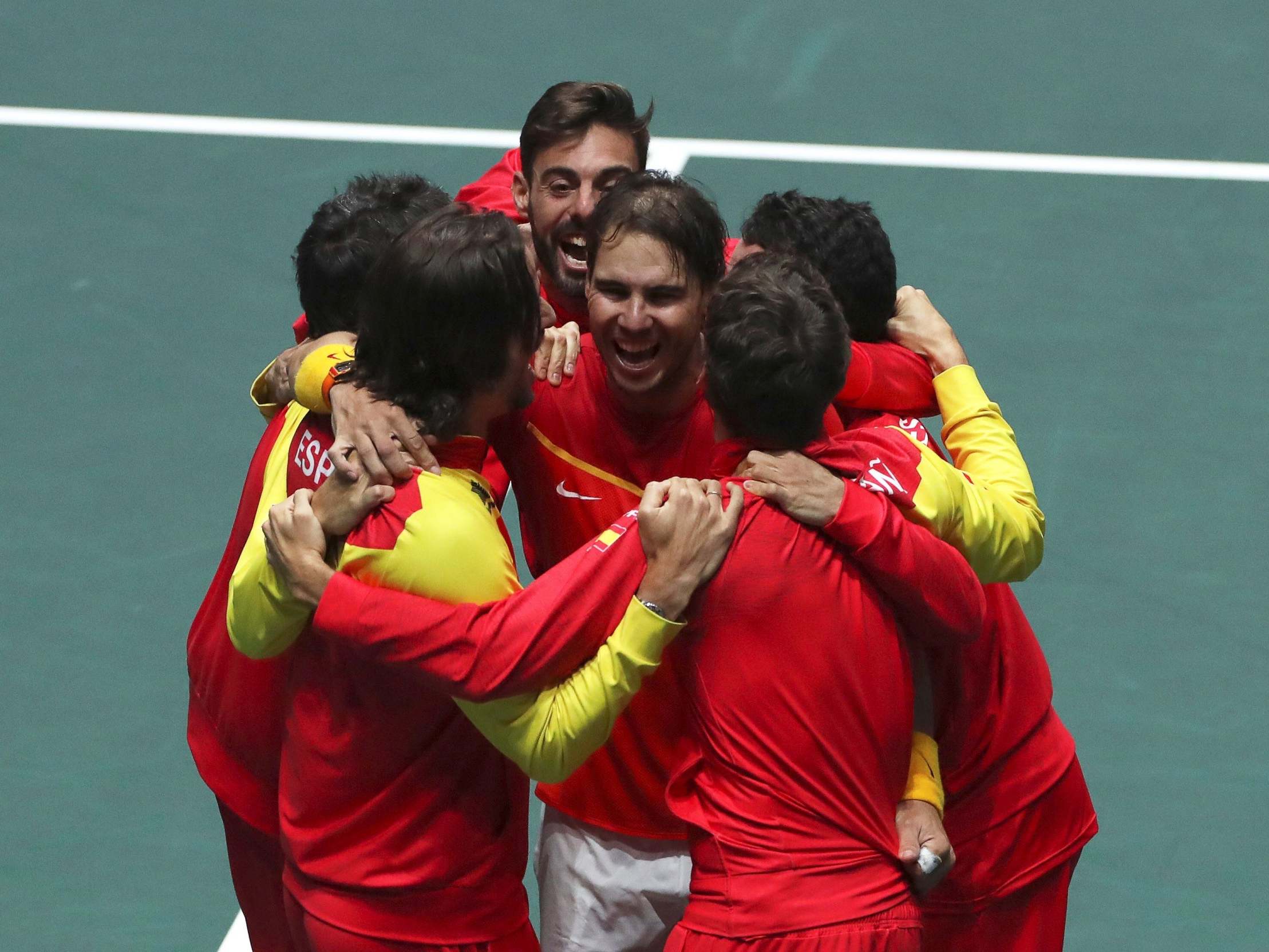 Nadal is joined by teammates after victory