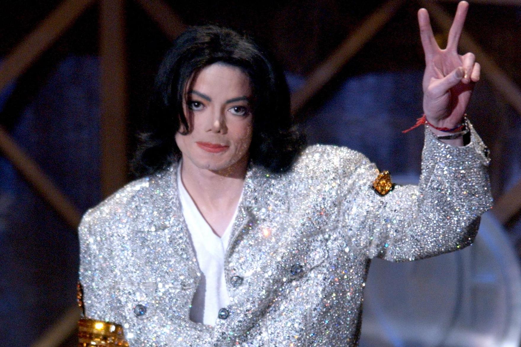 Michael Jackson accepts his Artist of the Century Award at the American Music Awards in 2002 (Getty)