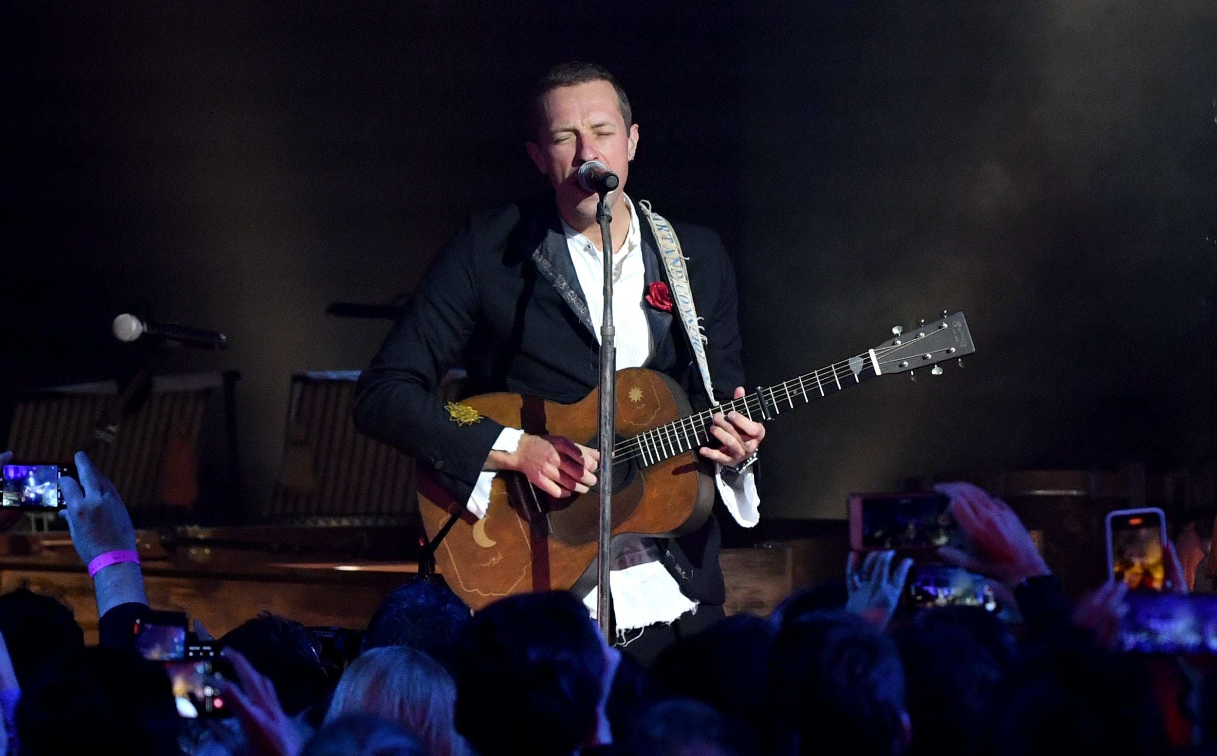 Chris Martin from Coldplay performs at the Natural History Museum