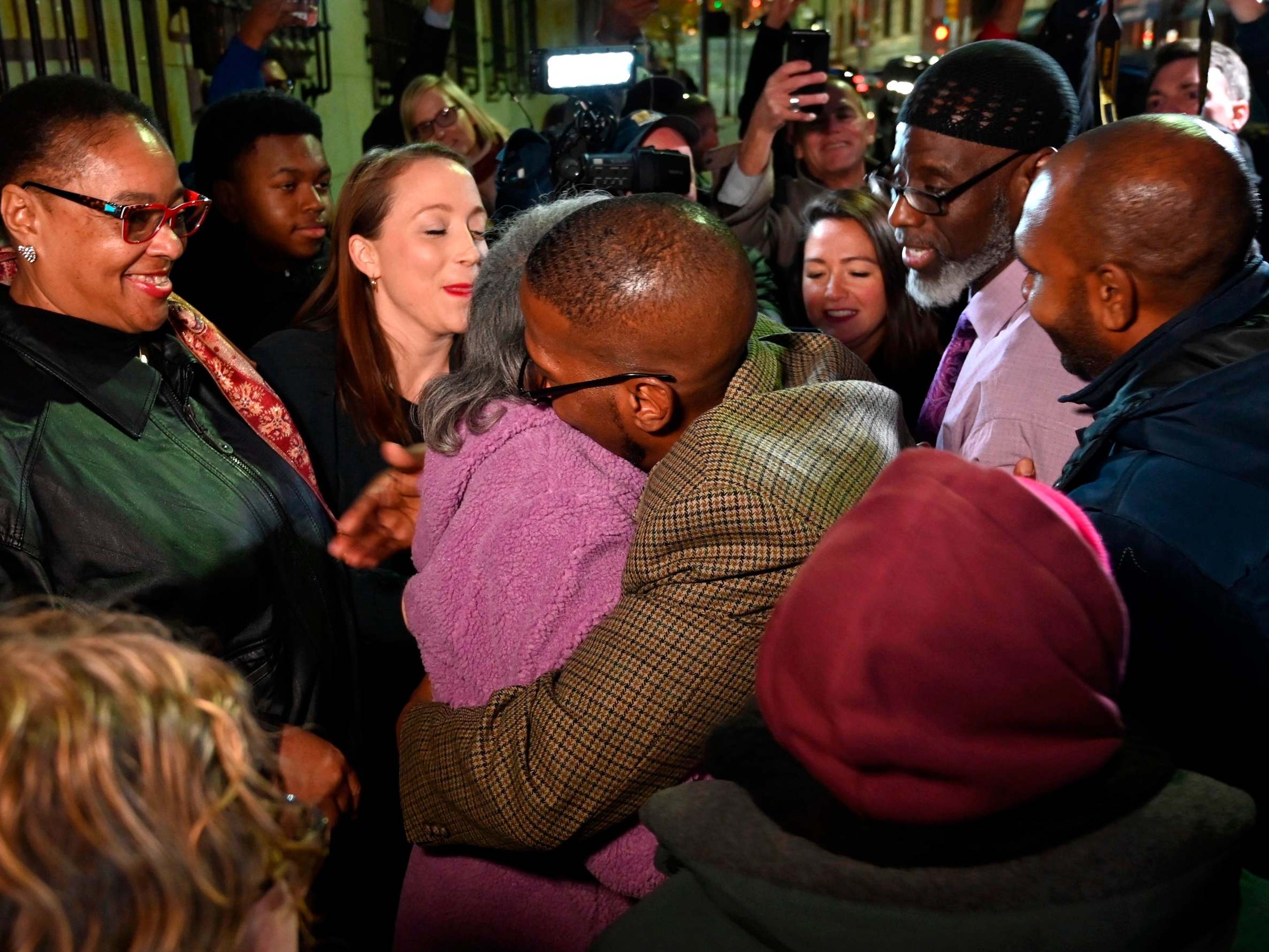 Alfred Chestnut hugs his mother Sarah after his release from prison in Baltimore, Maryland, US, on 25 November 2019 after serving 36 years for a murder he did not commit.