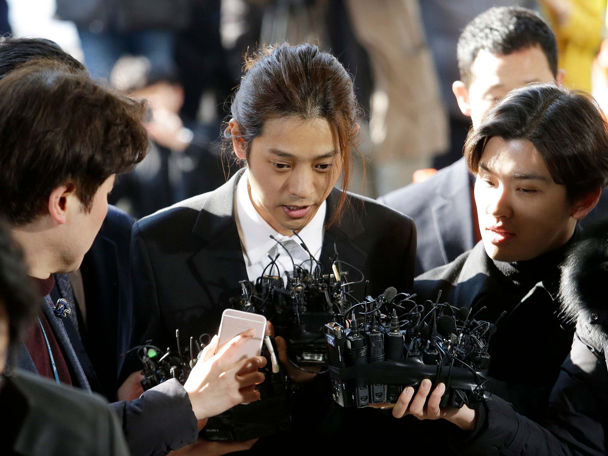 K-pop singer Jung Joon-young, pictured here arrives at Seoul Metropolitan Police Agency in South Korea in March, was jailed for six years on 29 November for rape and sharing videos he secretly filmed during sex with women